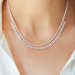 The Deco Feather Collar Necklace showcases a floral motif with marquise and round-cut diamonds in 18k white and rose gold. Its adjustable chain ensures a perfect fit, adding elegance to any look.