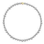 The Collet Set Graduating Round Diamond Necklace in Black Rhodium features a line of round, graduating diamonds, elegantly set and finished with a petite 18k yellow gold clasp at the top.
