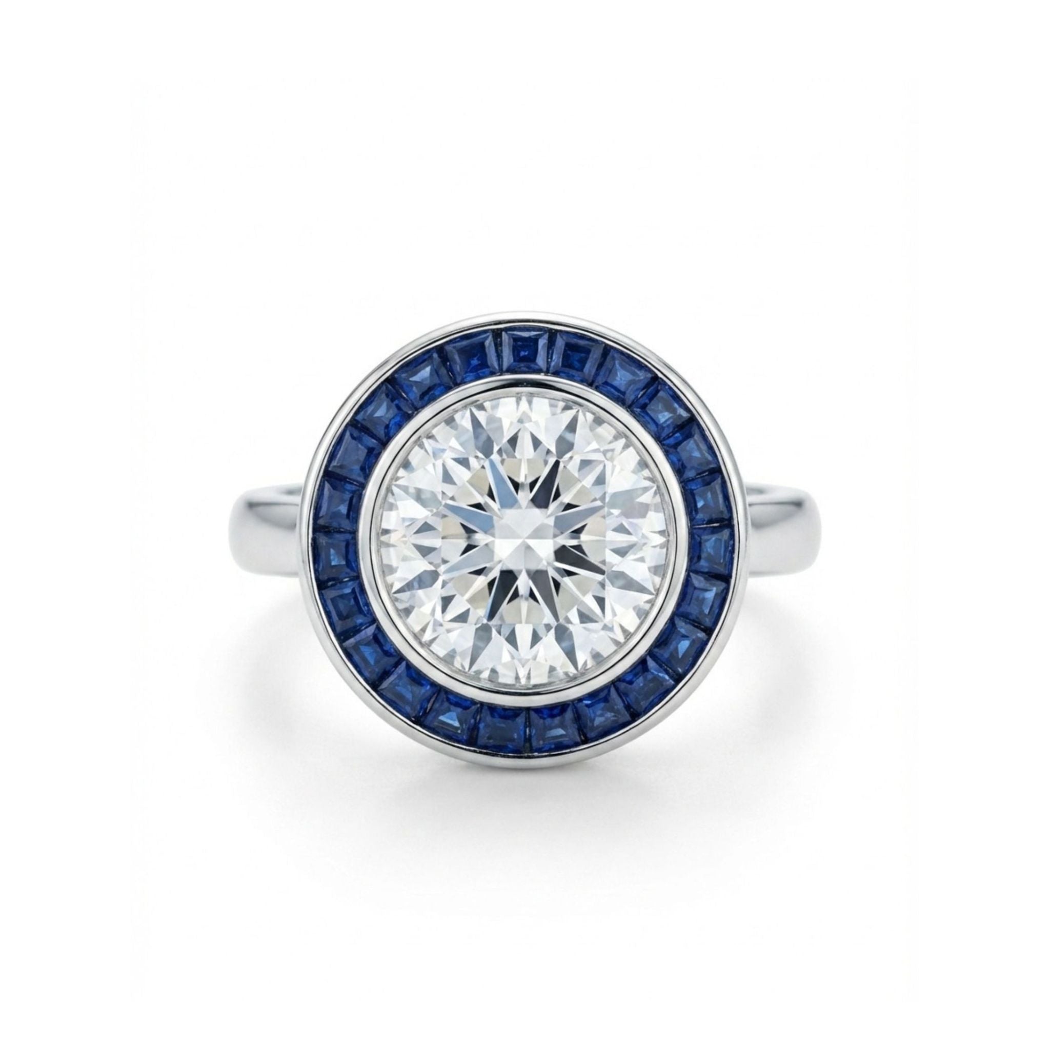 A Round Brilliant Diamond with Channel Set Sapphire Halo Ring, featuring a large round diamond center stone encircled by channel-set square blue sapphires, displayed on a white background.