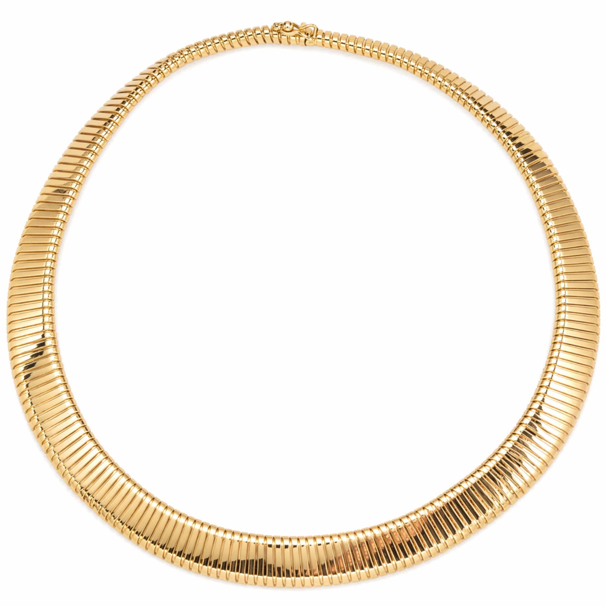 The Tiffany & Co. Tubogas Collar Necklace features a flexible, flat, ribbed design crafted in 14K gold and is showcased in a circular shape against a white background.