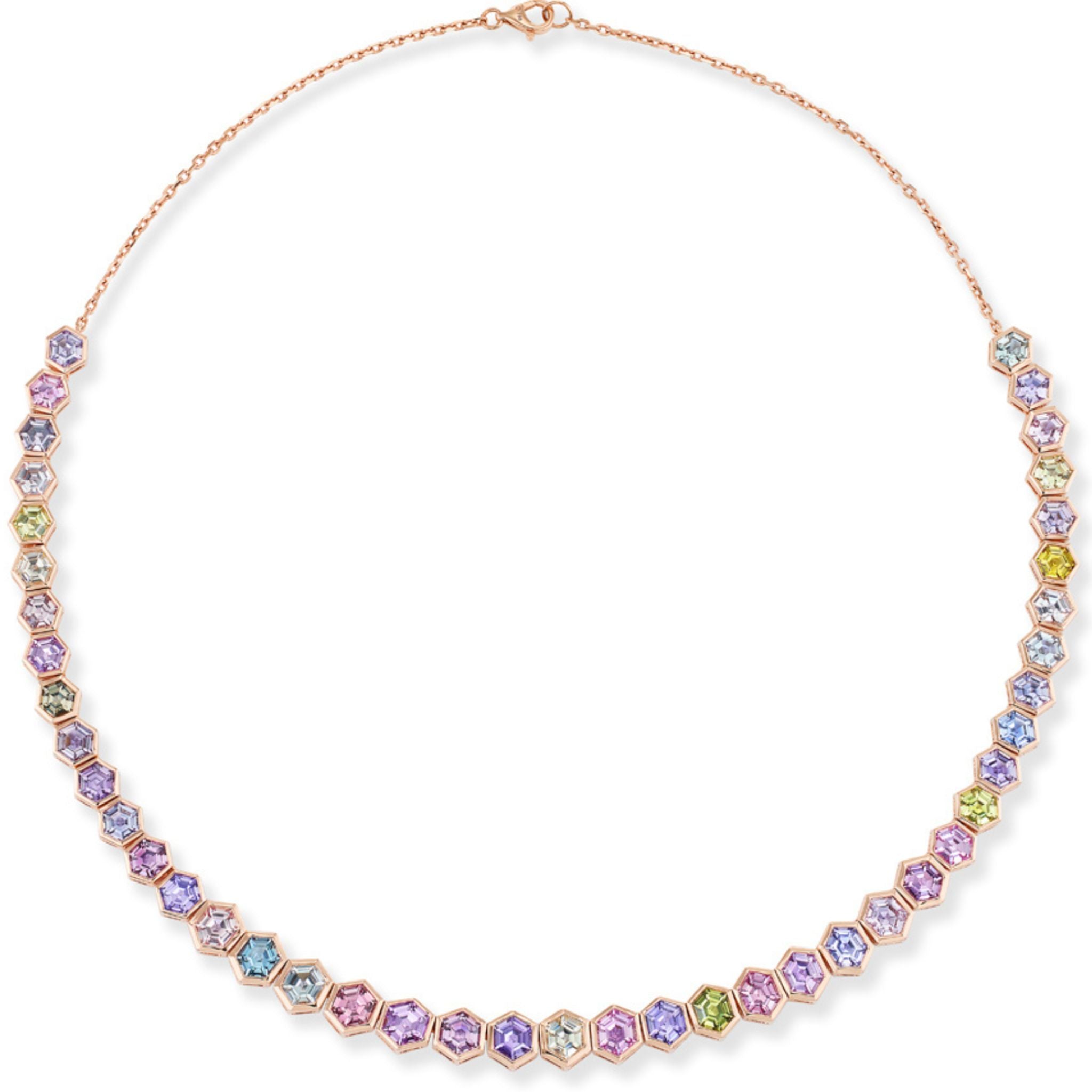 Introducing the Spectrum Collar Necklace: meticulously crafted in 18k rose gold, this stunning piece showcases bezel-set, multicolor hexagonal sapphires arranged in a symmetrical gradient for a vibrant and modern statement.