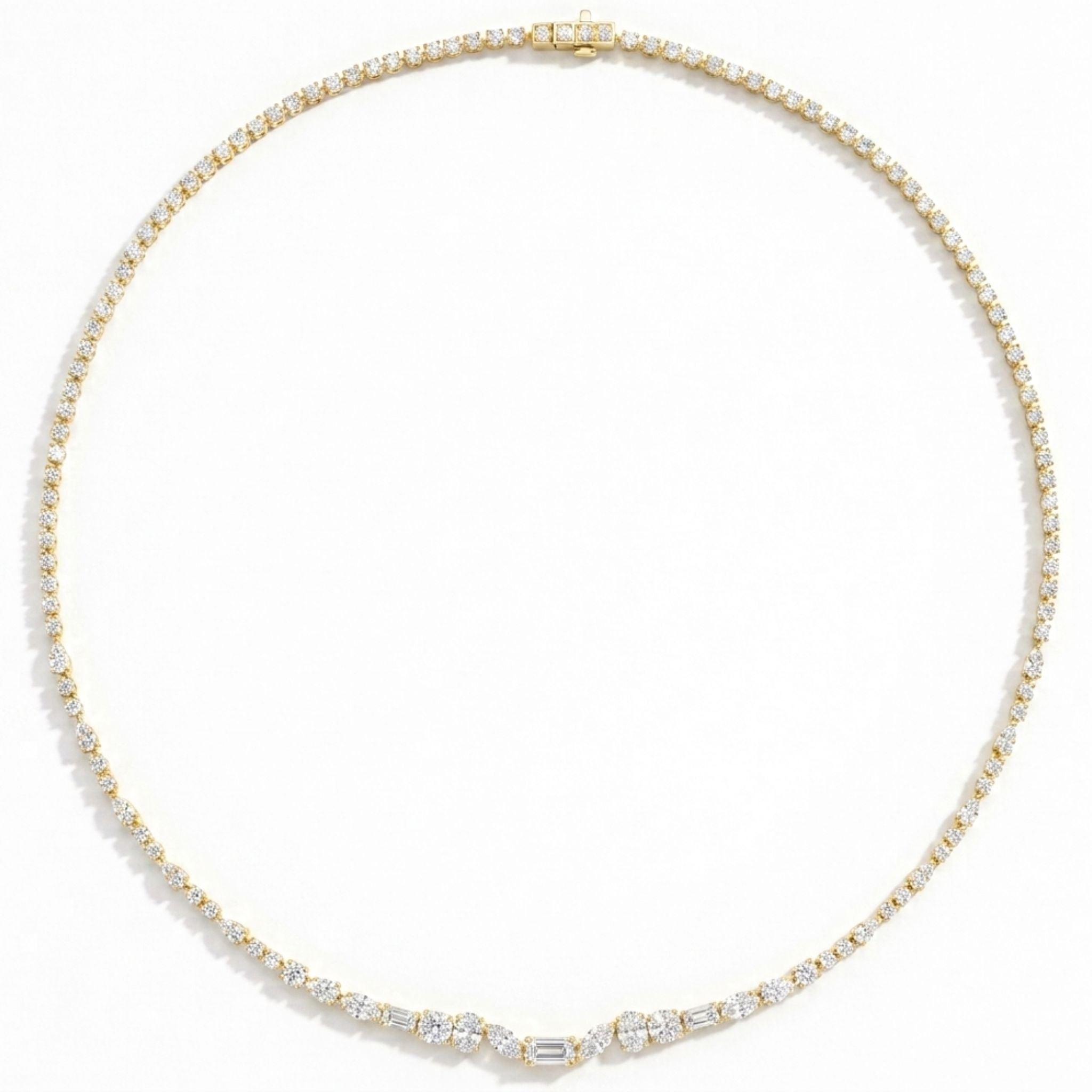 The East-West Mixed Shape Diamond Tennis Necklace in Yellow Gold features small, round diamonds evenly spaced along a delicate 18K yellow gold chain and is highlighted by a central cluster of mixed shape diamonds, all displayed on a plain white background.