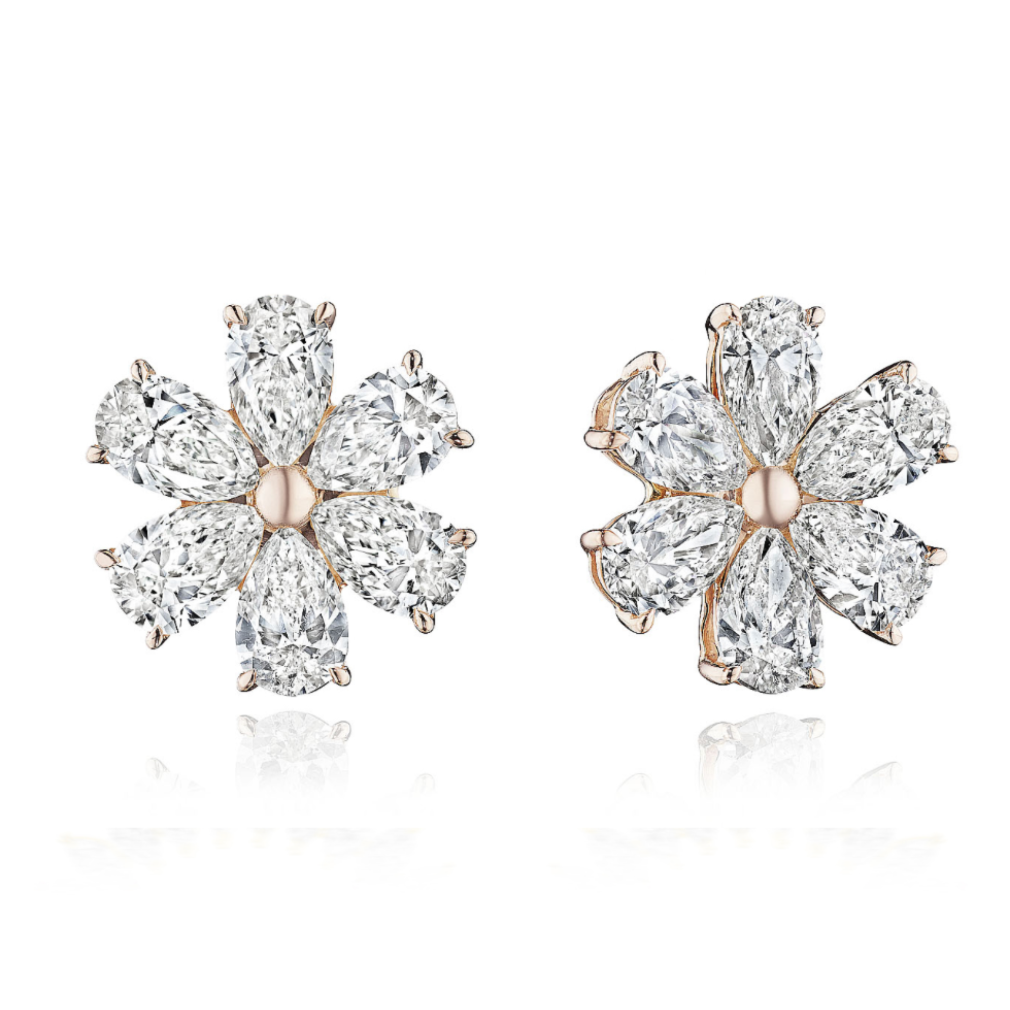 The Diamond Pear Shape Studs in Rose Gold showcase six clear SI clarity pear-shaped diamonds as petals around a gold center, all elegantly set in 18k rose gold.