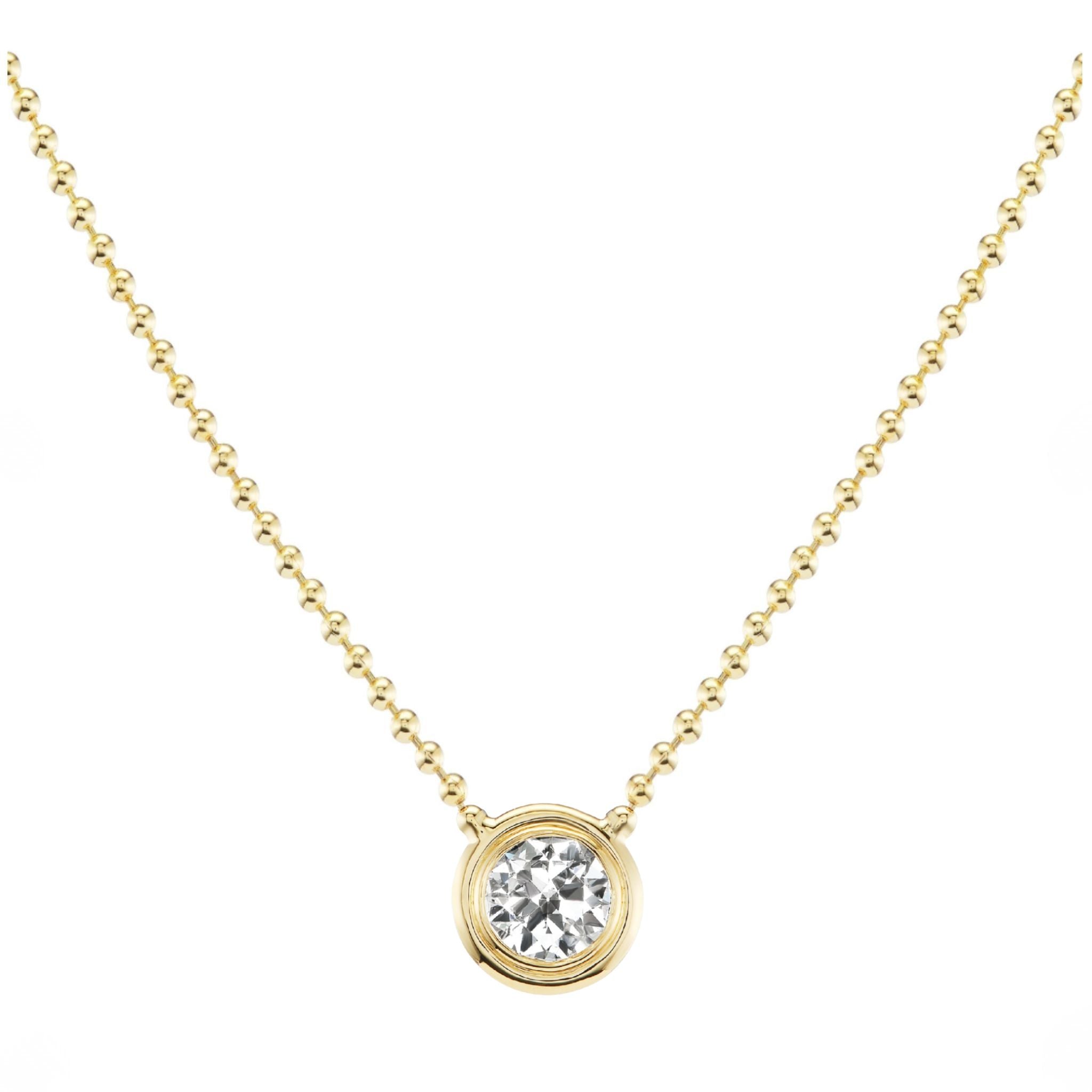Introducing the Bezel Set Round Diamond Ball Chain Necklace in Yellow Gold, featuring a round diamond pendant elegantly set in a simple 18K yellow gold bezel.