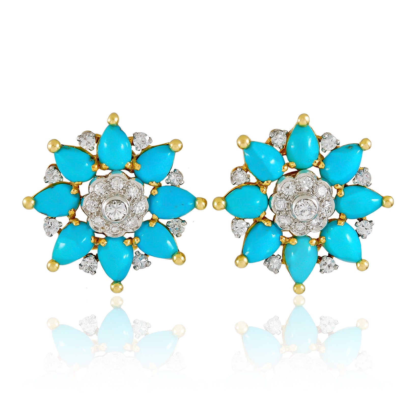 The Marchak Turquoise and Diamond Earclips feature turquoise cabochons and sparkling diamonds set in gold-tone metal, adding a vibrant pop of color to any look.