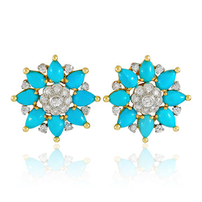 The Marchak Turquoise and Diamond Earclips feature turquoise cabochons and sparkling diamonds set in gold-tone metal, adding a vibrant pop of color to any look.