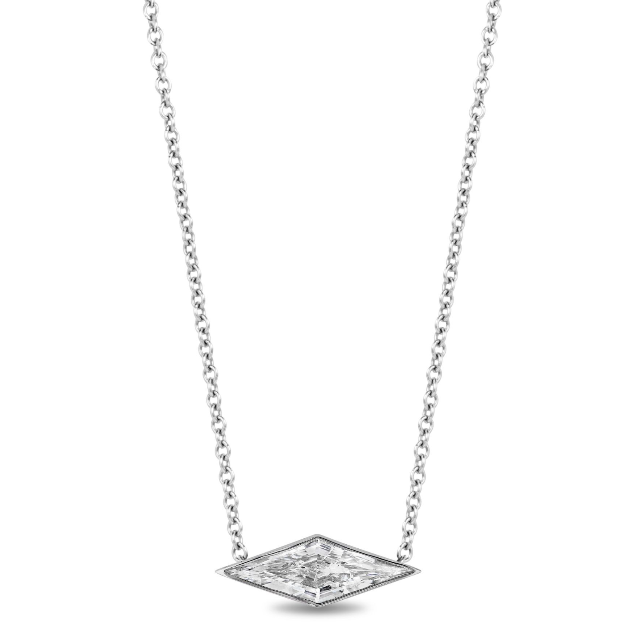 The East-West Bezel Set Kite Diamond Pendant features a silver chain and a kite-shaped, diamond-inspired clear gemstone in an 18K white gold minimalist frame, shown against a white background.