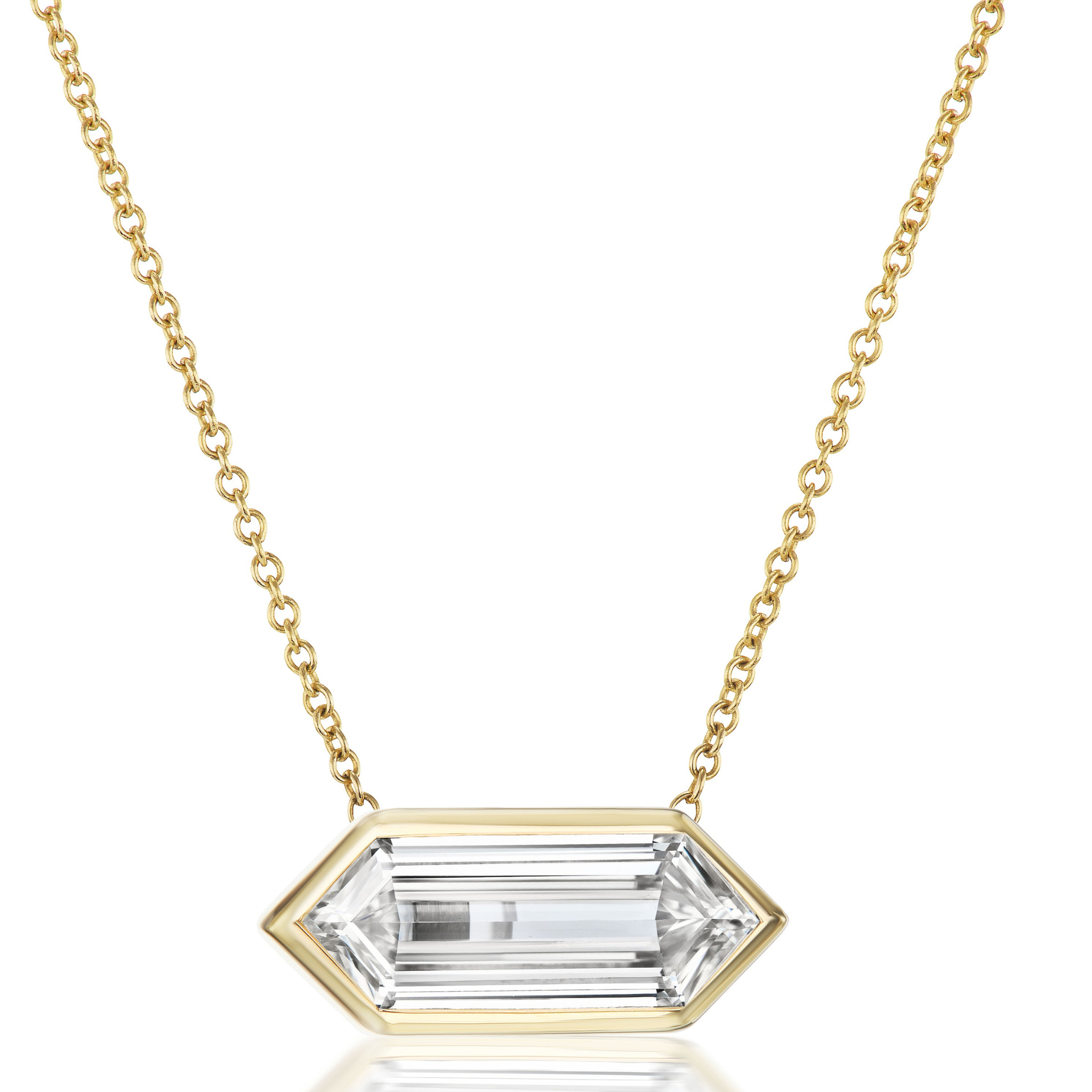 The East-West Bezel Set Lozenge Diamond Pendant Necklace in Yellow Gold features an elongated lozenge diamond set horizontally in an 18K yellow gold bezel setting.