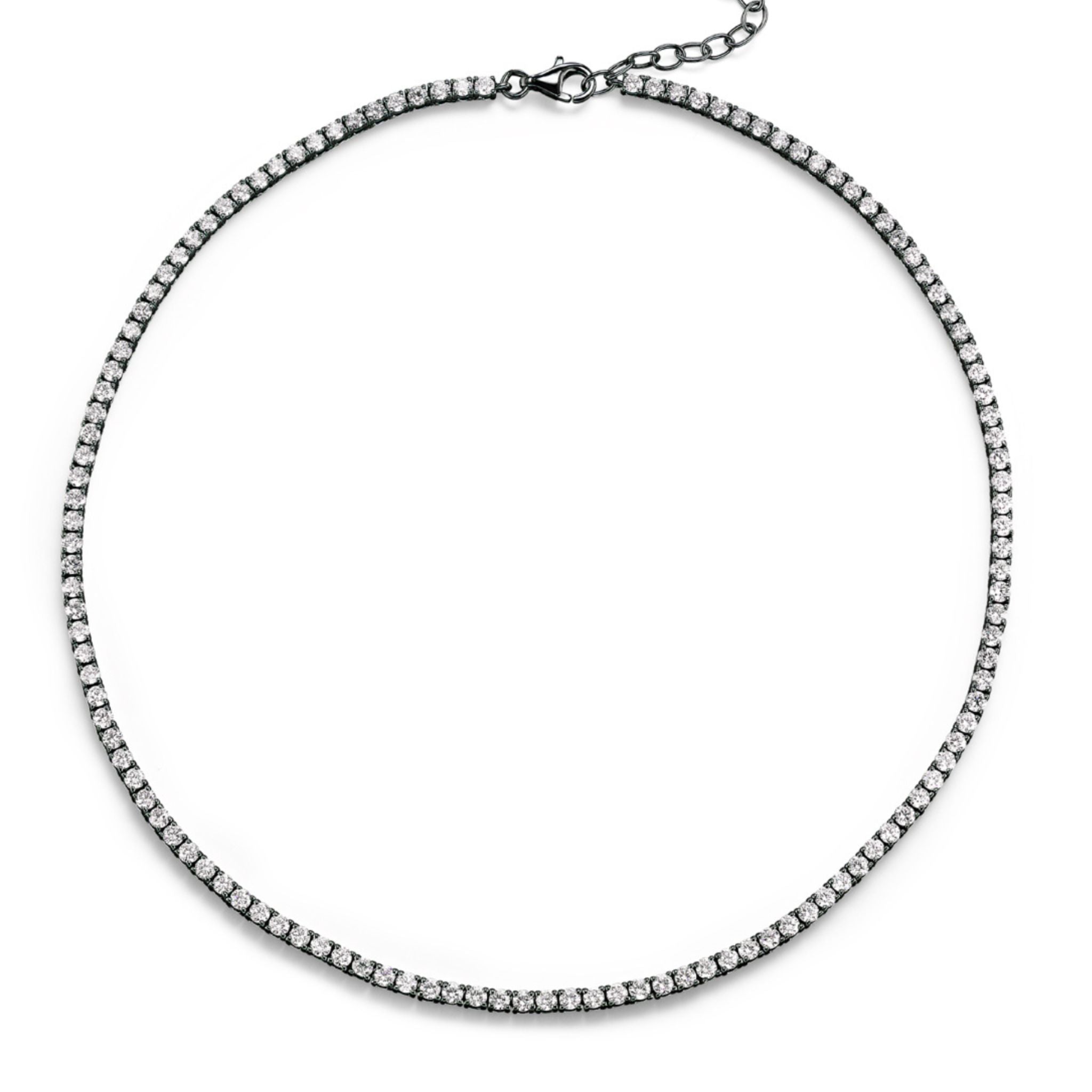 The Round Diamond Tennis Necklace in Black Rhodium showcases a sleek row of petite round brilliant diamonds set in an 18k black rhodium plated gold or white gold chain, elegantly arranged in a circular display against a white background.