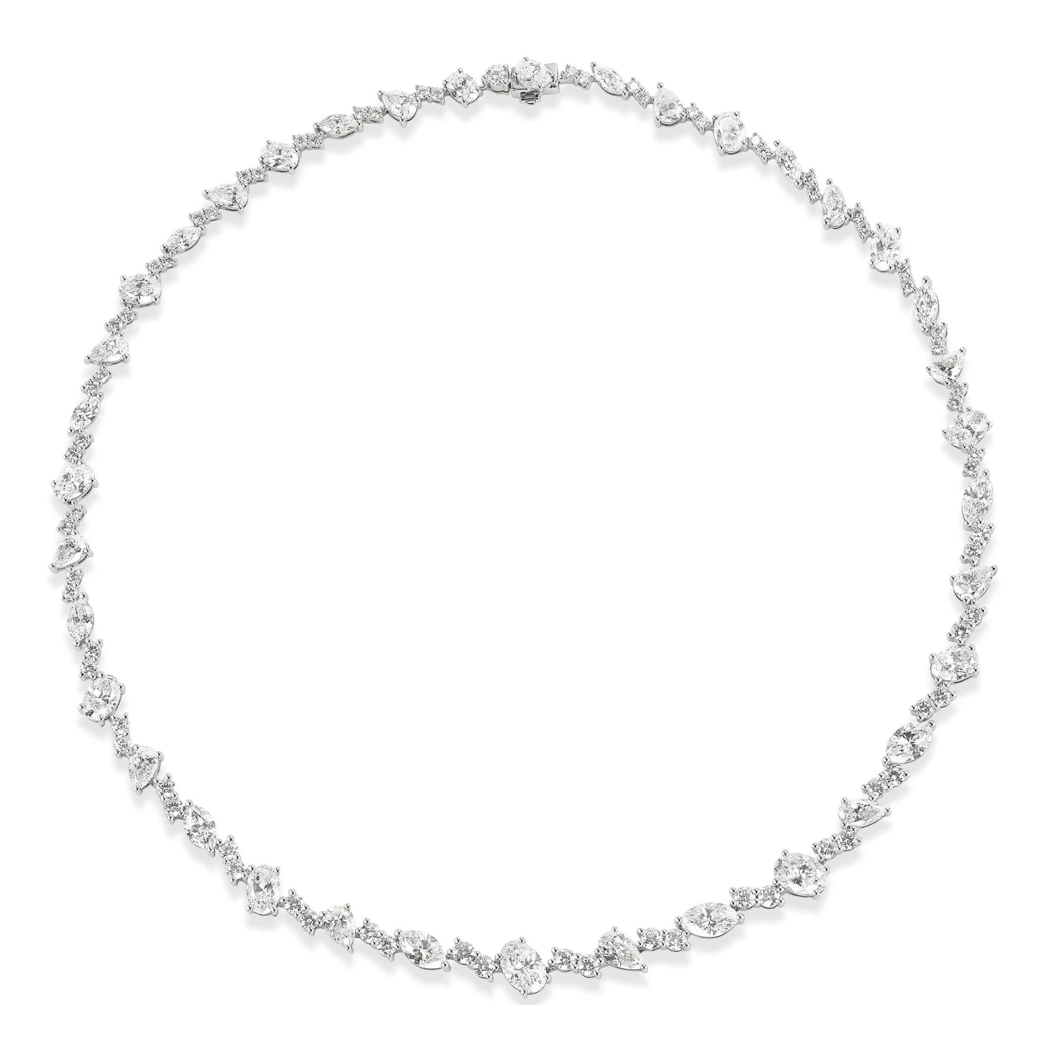 The Mixed Shape Diamond Tennis Necklace in White Gold features an elegant arrangement of differently shaped diamonds set in a seamless, symmetrical line on a slender 18K white gold chain, shown against a white background.