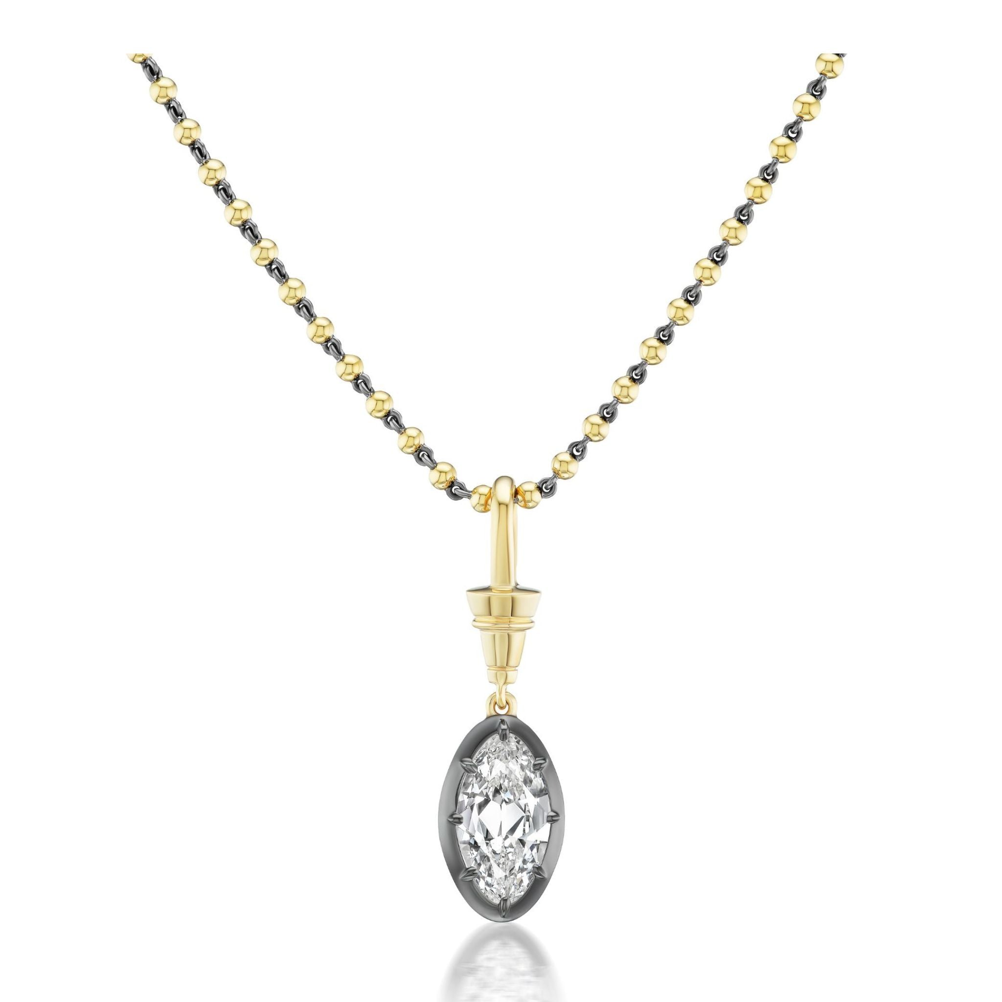 A Collet Set Old Mine Diamond Necklace in yellow gold and black rhodium featuring an 18k yellow gold chain with gold and black beads, and a single marquise-cut VS2 clarity diamond pendant set in a silver bezel.