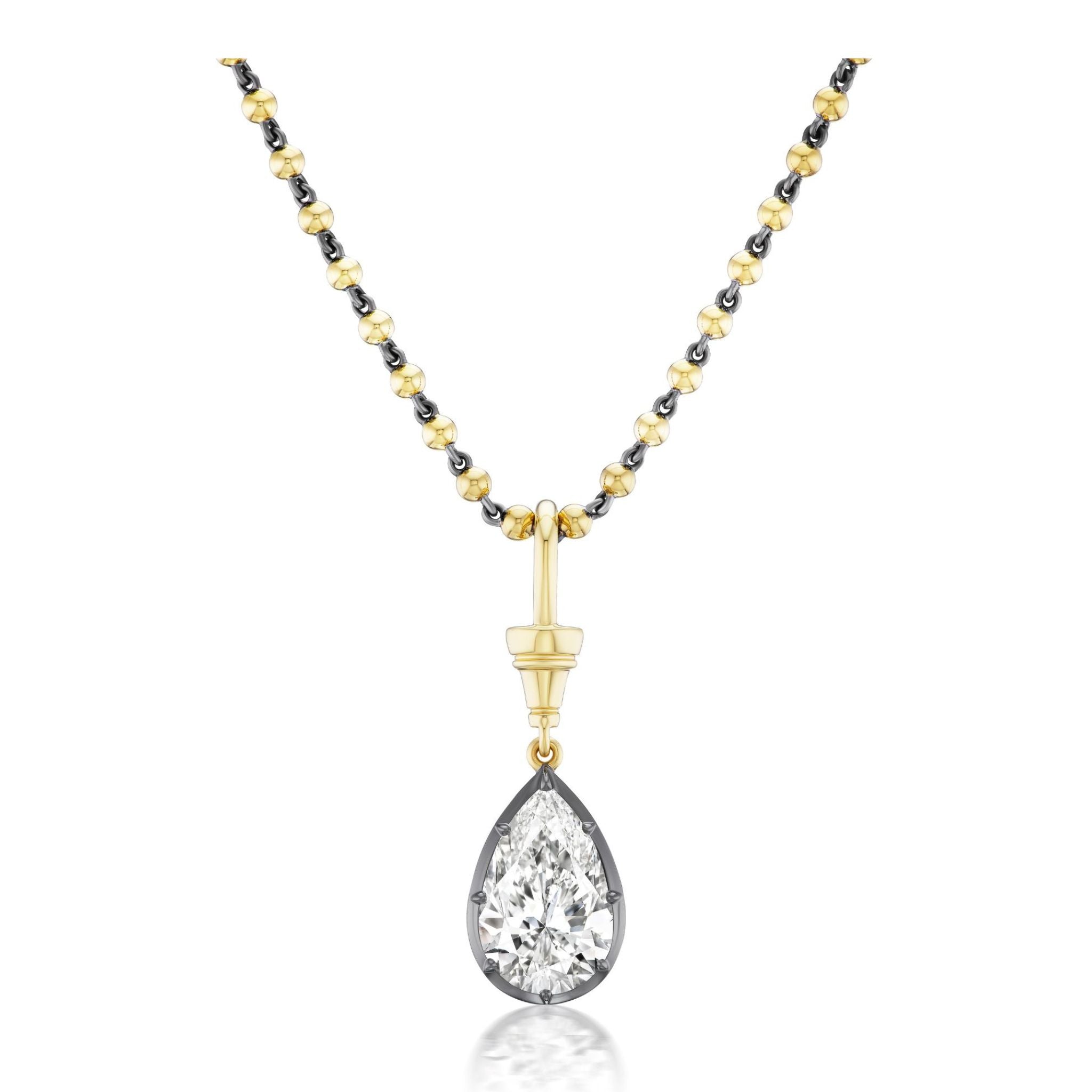 Collet Set Pear Shape Diamond Necklace in Black Rhodium and Yellow Gold, showcased elegantly on a white background, featuring gold and black beads with a striking pear-shaped diamond pendant set in luxurious yellow gold and black rhodium.