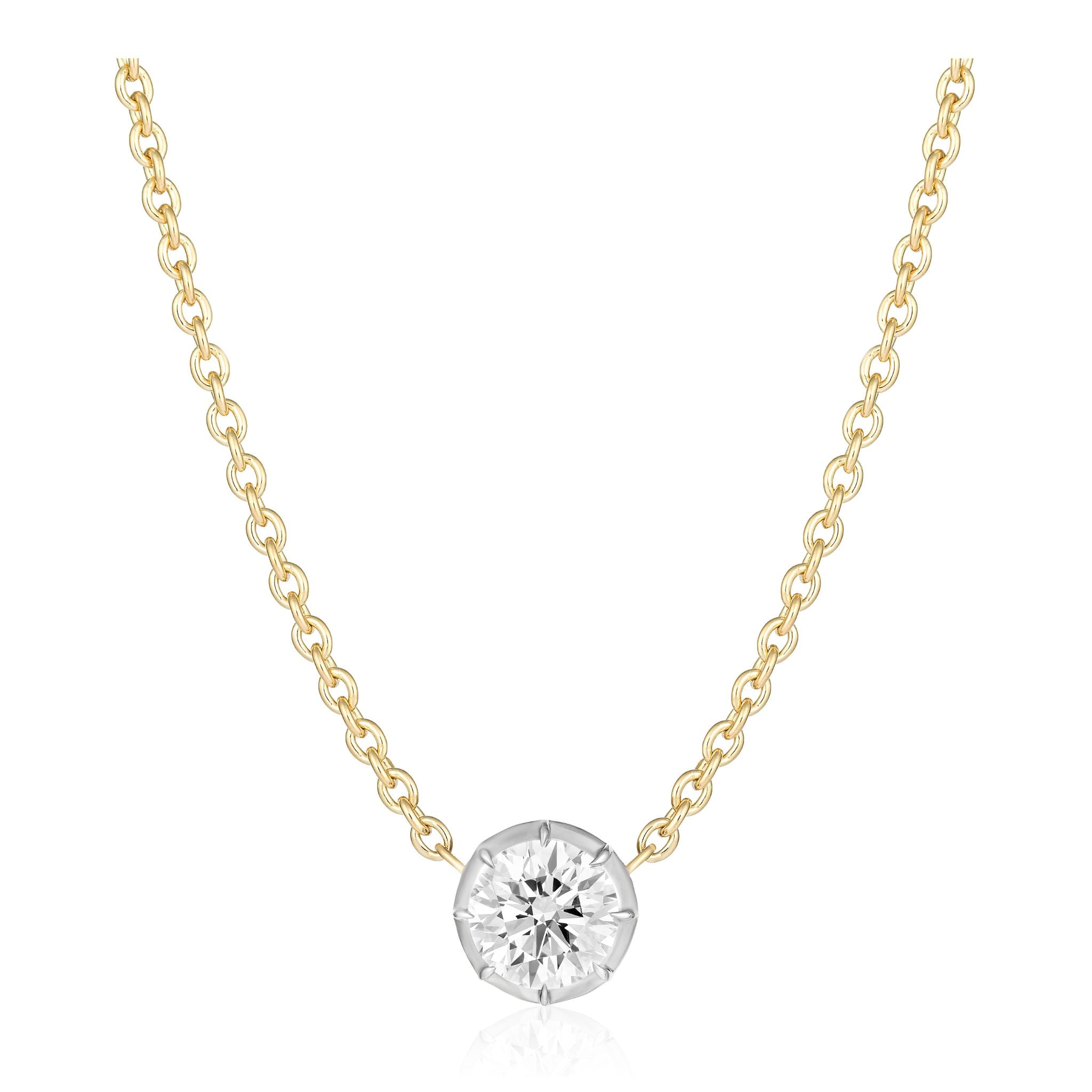Collet Set Round Diamond Pendant in White and Yellow Gold featuring a delicate 18K yellow gold chain with a single round brilliant diamond solitaire in a minimalist bezel (collet) setting, expertly crafted and photographed on a white background.