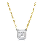 The Mosaic Pendant Necklace showcases an Asscher cut diamond set in a silver bezel, suspended from a yellow gold chain and accented with tapered baguette diamonds for extra brilliance.