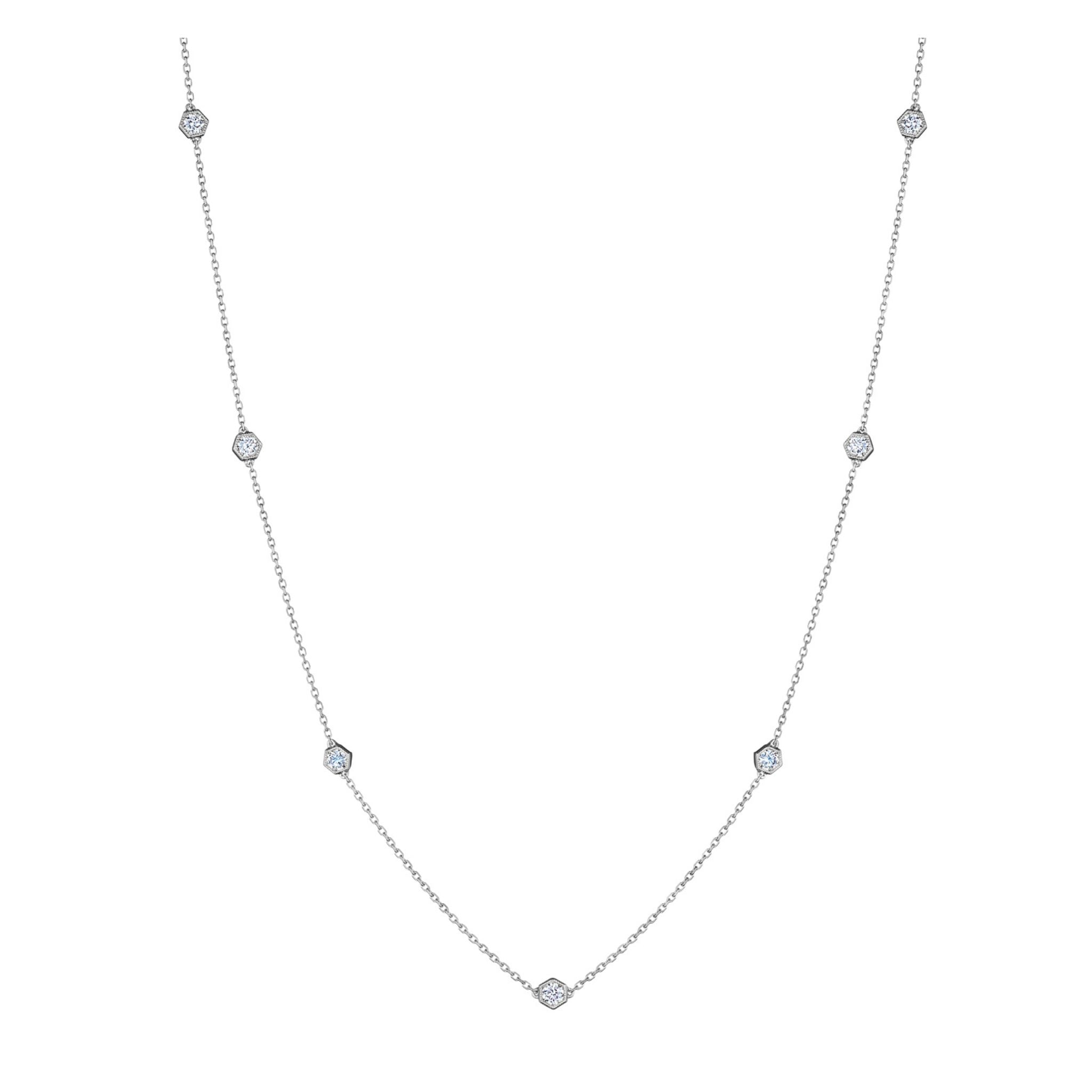 Large Serpentine Station Necklace featuring hexagon bezel set diamonds spaced along a slender silver chain, displayed on a white background.