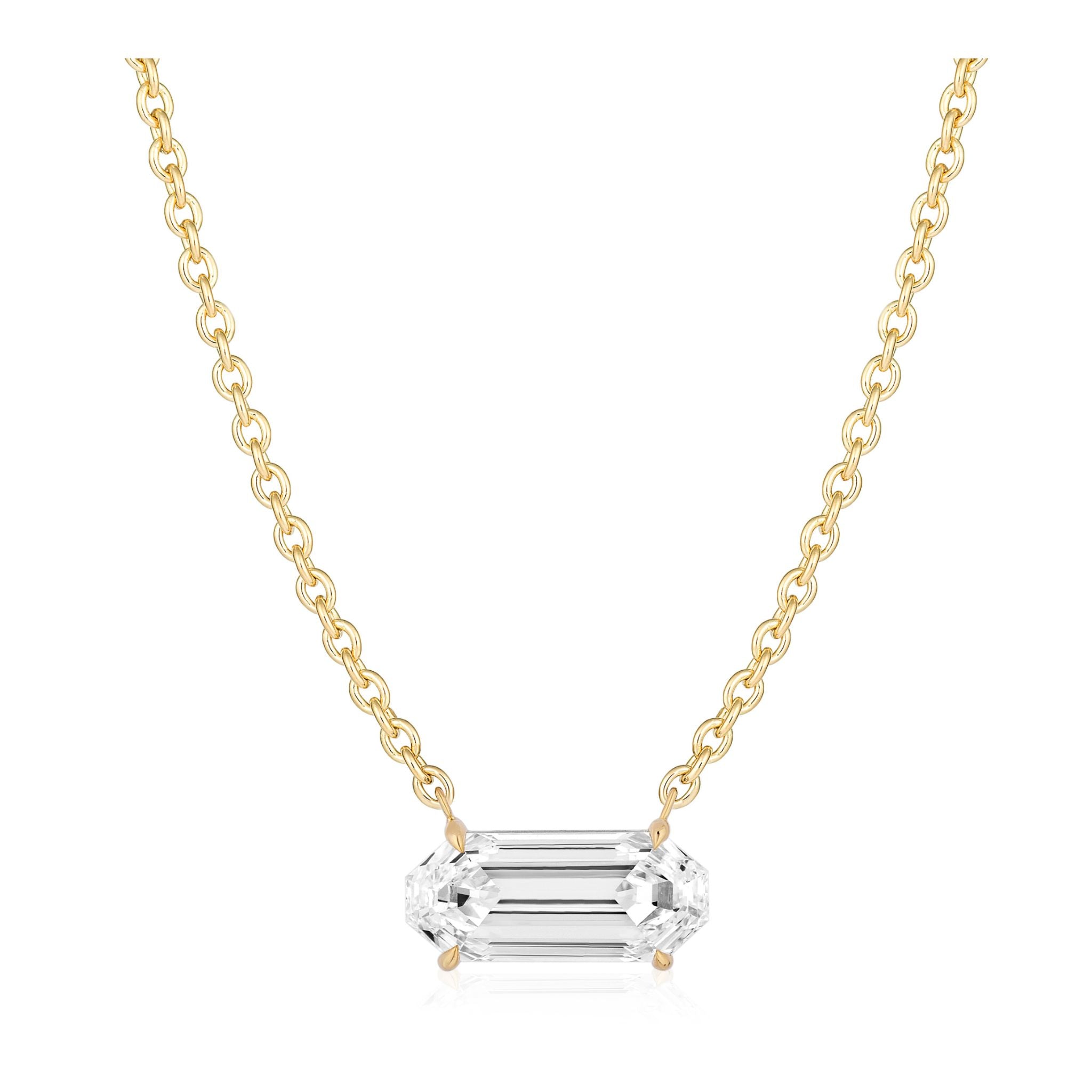 East-West Elongated Octagonal Diamond Pendant in Yellow Gold displayed on a gold chain necklace with a horizontally set, elongated octagonal diamond pendant in 18k yellow gold against a white background.