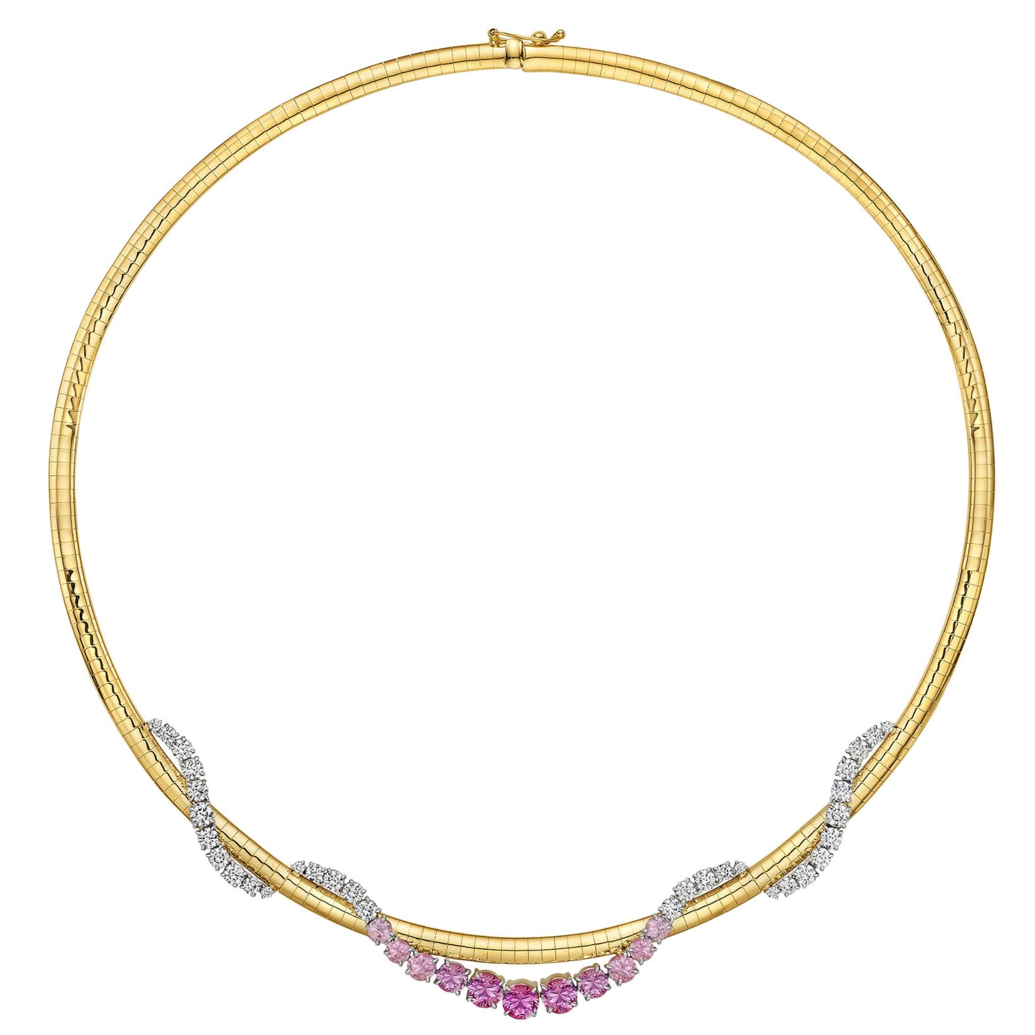 Introducing the Pink Coil Graduated Round Sapphire and Diamond Omega Chain Necklace, expertly crafted in yellow gold and platinum. This elegant necklace features a striking geometric pattern with alternating swirling sections of white diamonds and a central row of vivid pink sapphires. Its symmetrical design is complemented by a secure clasp, making it the perfect accessory for any occasion.