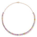 Introducing the Spectrum Collar Necklace in Rose Gold, exquisitely crafted with 18k rose gold and highlighted by bezel-set, multicolor hexagonal sapphires. These vibrant gemstones are arranged in a symmetrical pattern along the front, creating a sophisticated and modern statement piece that radiates vibrant elegance.