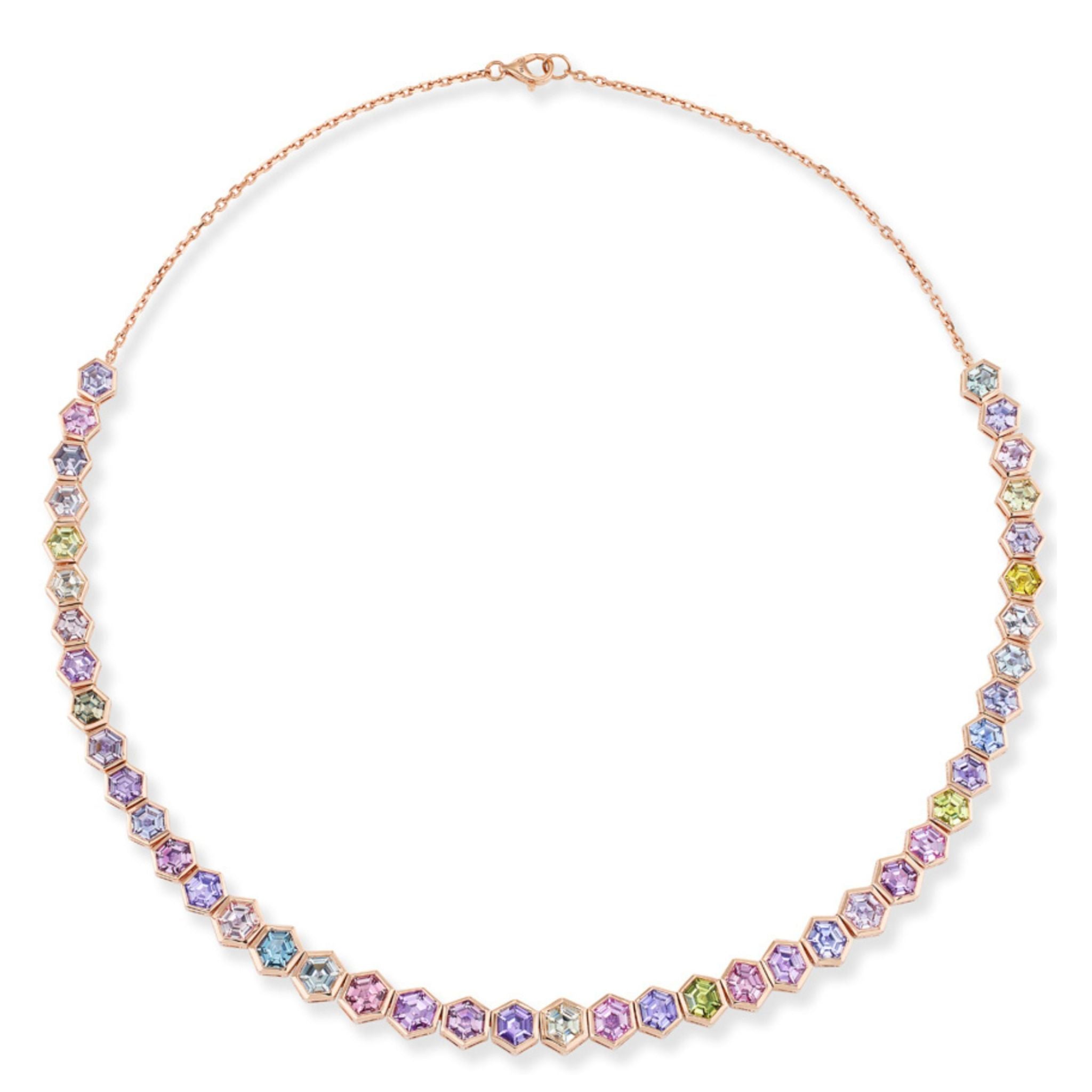 Introducing the Spectrum Collar Necklace in Rose Gold, exquisitely crafted with 18k rose gold and highlighted by bezel-set, multicolor hexagonal sapphires. These vibrant gemstones are arranged in a symmetrical pattern along the front, creating a sophisticated and modern statement piece that radiates vibrant elegance.