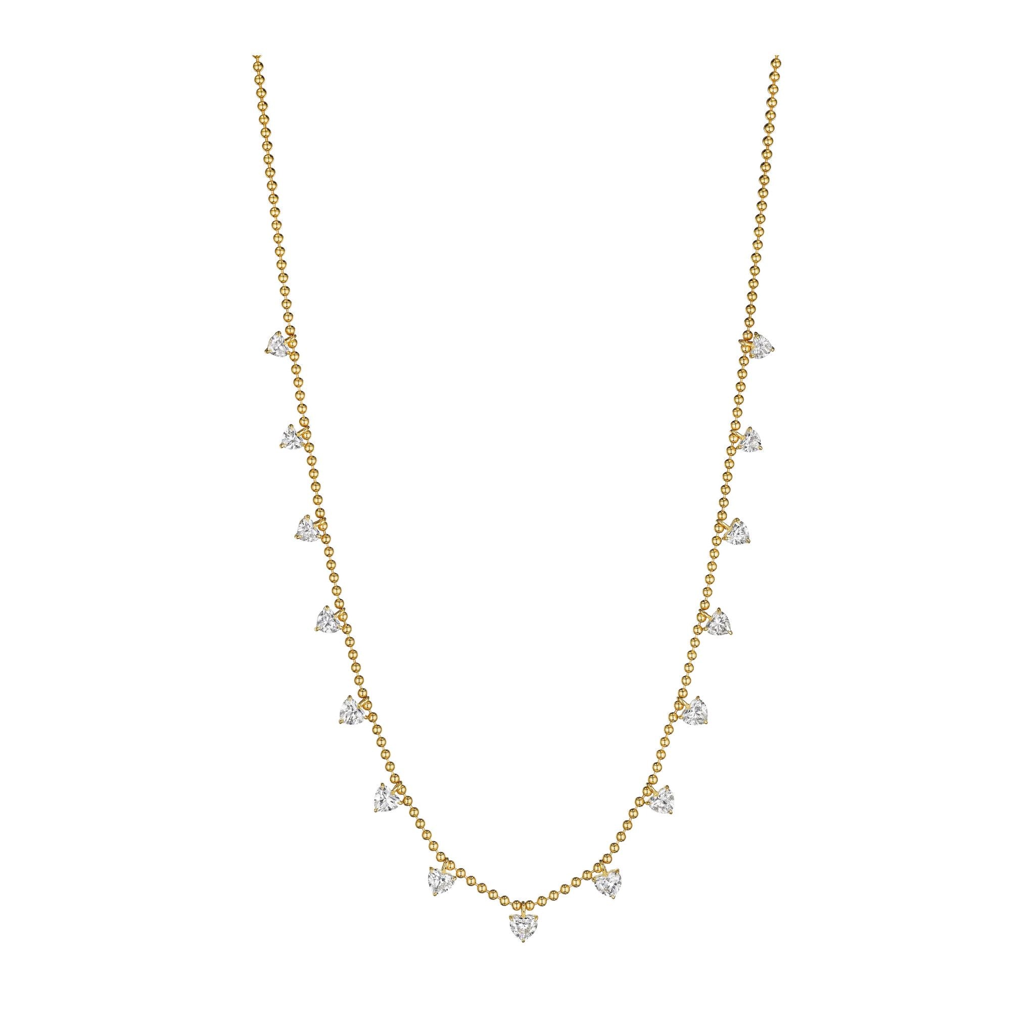 Heart Shape Diamond Station Necklace with Yellow Gold Ball Chain features small, heart-shaped diamonds delicately suspended along the lower part of a radiant 18K yellow gold ball chain, offering a simple yet elegant look with sparkling heart diamonds displayed against a white background.