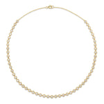 Introducing the Octagonal Bezel Set Tennis Necklace with Round Diamonds—an elegant strand crafted in 18k gold, showcasing evenly spaced round brilliant diamonds of SI1 clarity set in distinctive octagonal bezel settings, displayed against a plain white background.