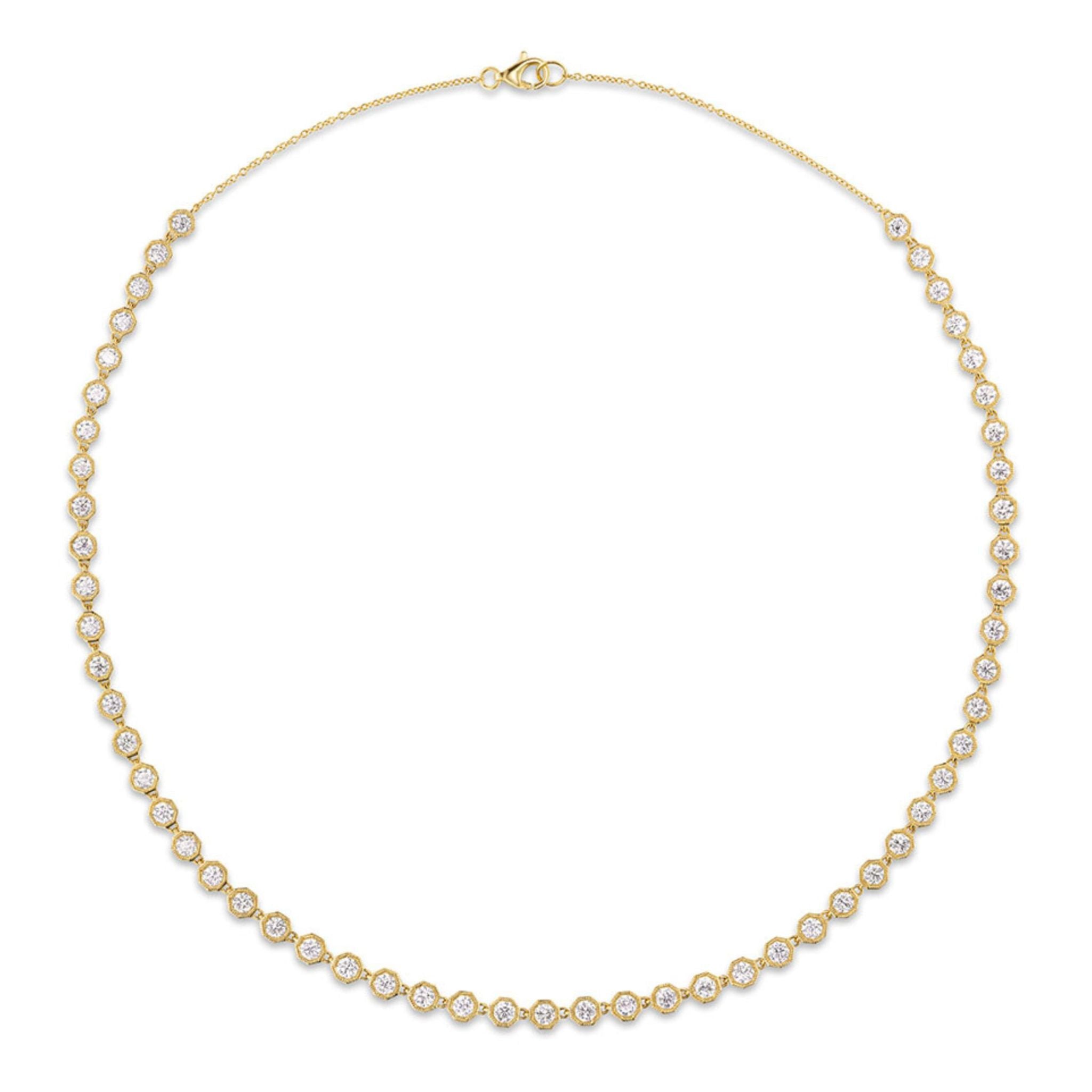 Introducing the Octagonal Bezel Set Tennis Necklace with Round Diamonds—an elegant strand crafted in 18k gold, showcasing evenly spaced round brilliant diamonds of SI1 clarity set in distinctive octagonal bezel settings, displayed against a plain white background.