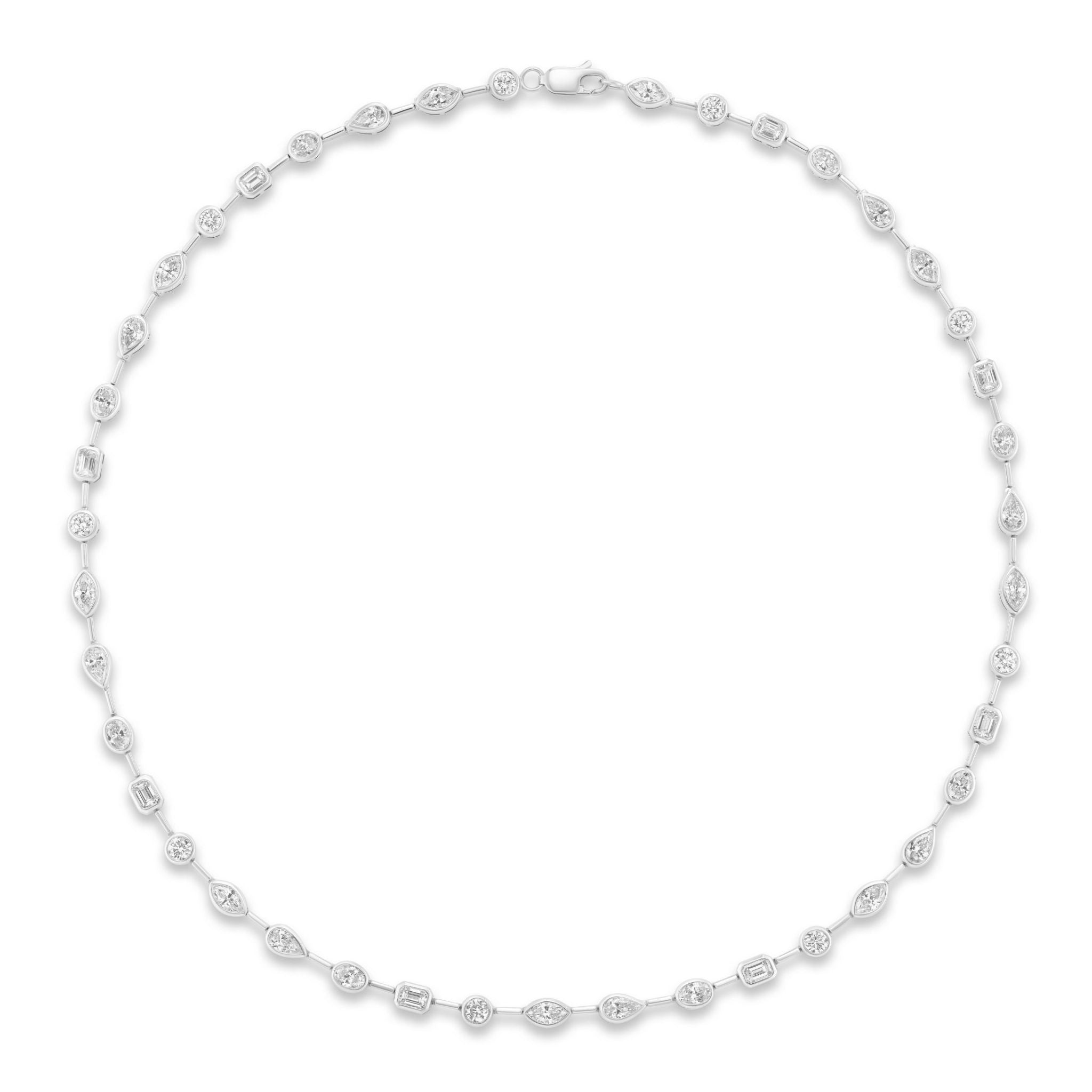 The Bezel Set Mixed Shape Diamond Necklace in White Gold showcases a graceful arrangement of G color oval, round, and rectangular diamonds, each bezel set and evenly spaced along an 18k white gold chain, beautifully presented on a plain white background.
