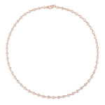 Introducing the Chasing Pears Diamond Garland Necklace: a delicate 18K gold necklace adorned with evenly spaced, pear-shaped diamonds totaling 5.50 carats. Each teardrop-shaped white gemstone is artfully arranged in a graceful garland design, shown against a crisp white background.