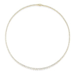 The Small Graduated Round Diamond Tennis Necklace in 18k gold showcases a full circle of petite, sparkling round diamonds that are elegantly graduated in size and evenly spaced along its entire length, beautifully displayed on a white background.