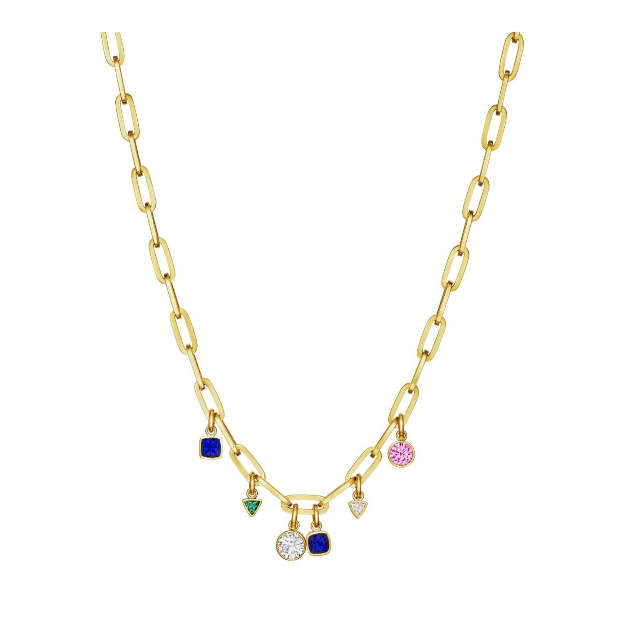 Introducing the Chain Necklace in Yellow Gold with Bezel Set Mixed Shape Sapphires, Diamonds, and Emeralds—expertly crafted in 18K yellow gold and featuring five evenly spaced front pendants: two cushion cut blue sapphires, a triangle-shaped emerald, a circular pink gem, and a round clear diamond.
