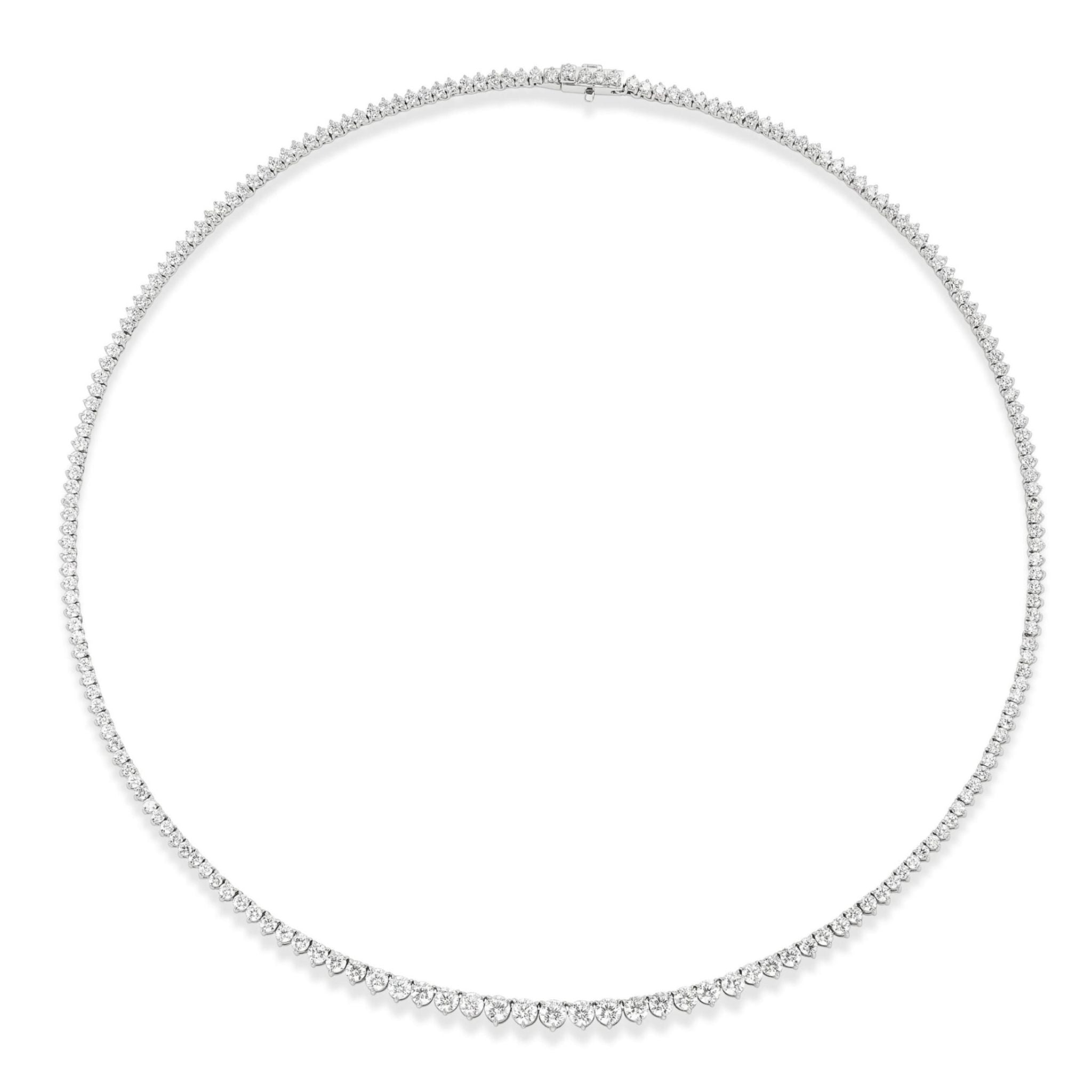 Introducing the Small Graduated Round Diamond Tennis Necklace—a refined piece crafted in 18k gold, showcasing a seamless row of closely set, graduated round diamonds for an elegant and timeless look against a white background.