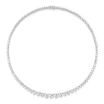 The Medium Graduated Round Diamond Tennis Necklace features a row of round diamonds that gradually increase in size toward the center, elegantly set in a slender 18k gold band.