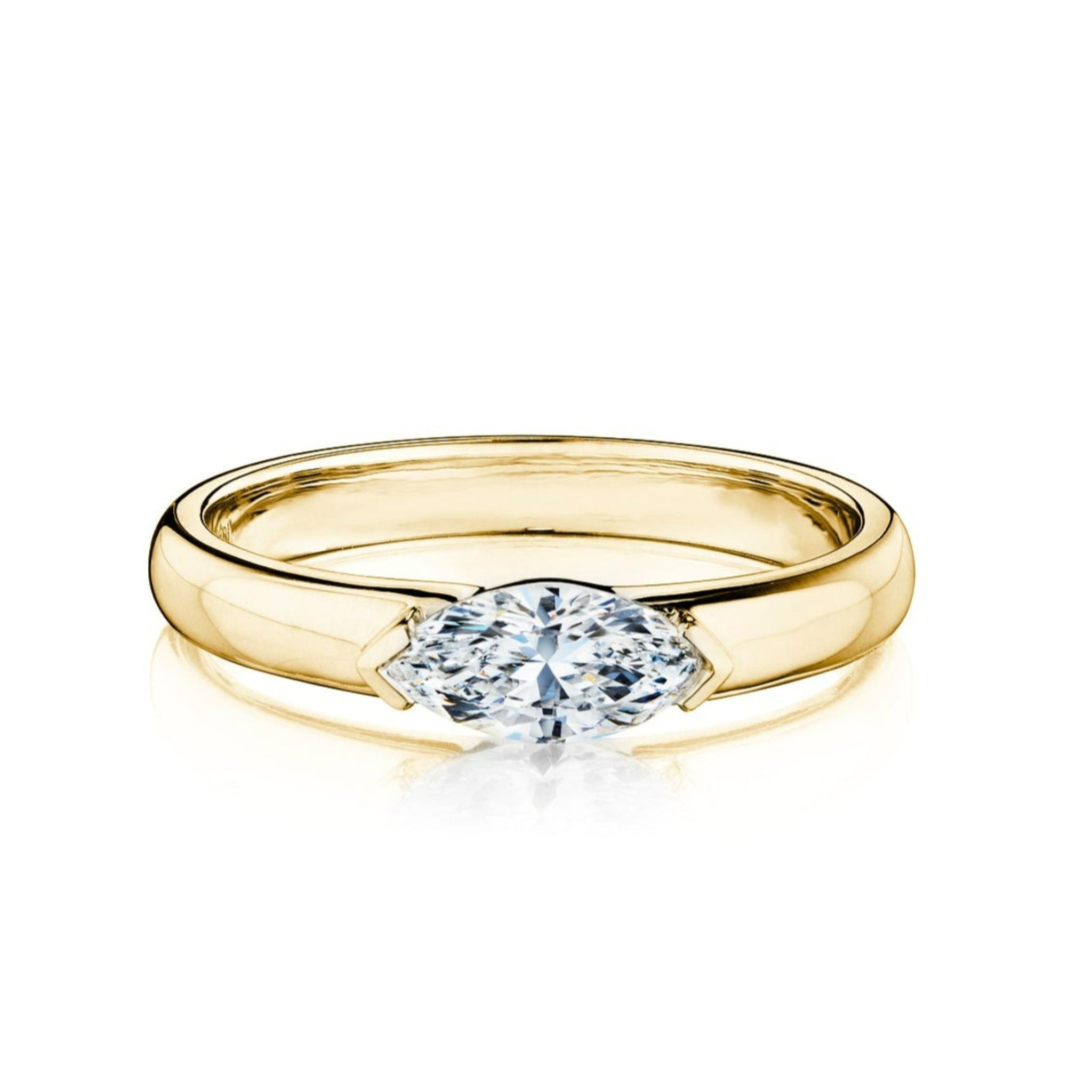 The East-West Marquise Diamond Solitaire Band showcases a marquise-cut diamond set horizontally on a simple 18K yellow gold band, displayed elegantly against a white background.