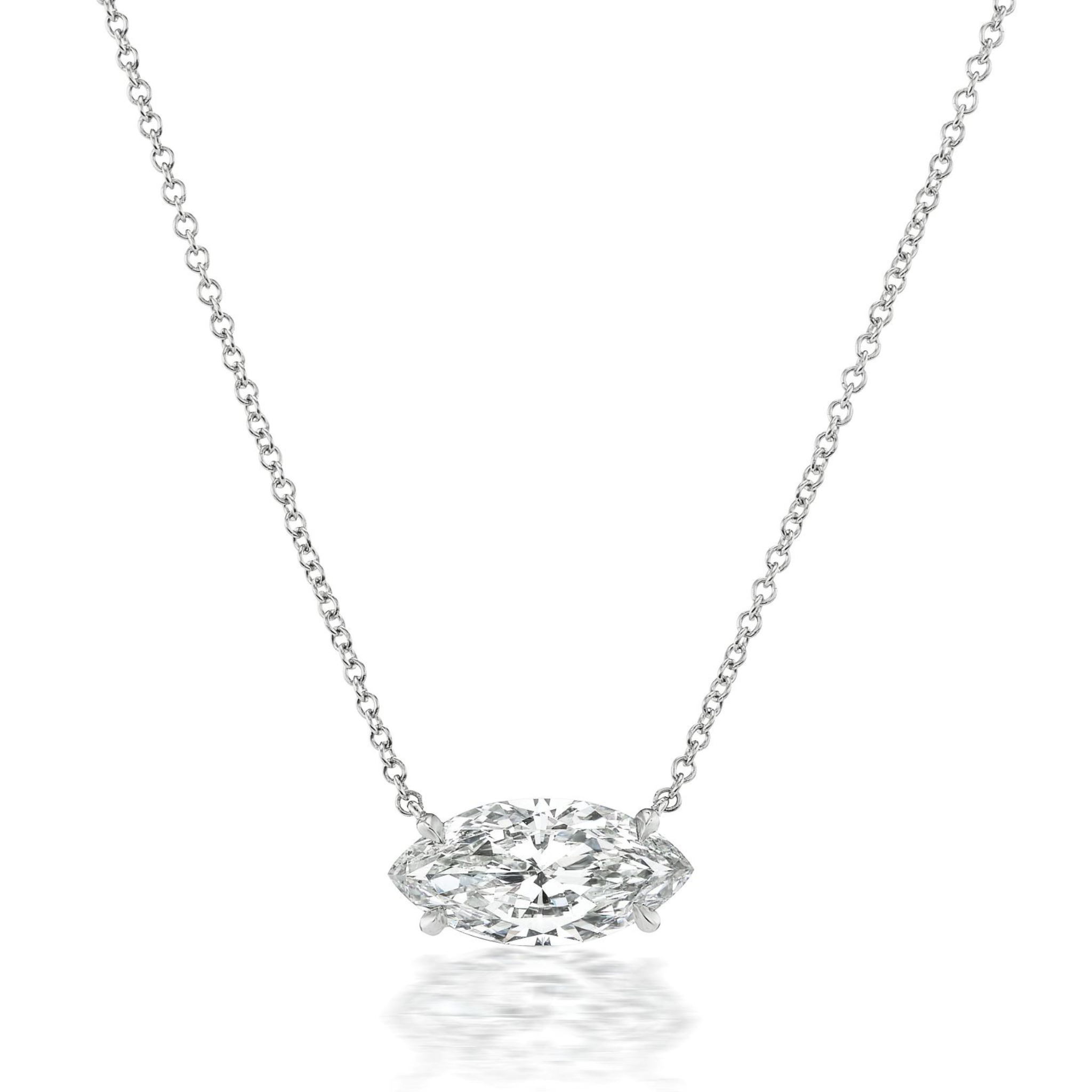 The East-West Marquise Diamond Solitaire Pendant in White Gold showcases a horizontally set marquise diamond on a delicate chain, offering elegant and modern style.