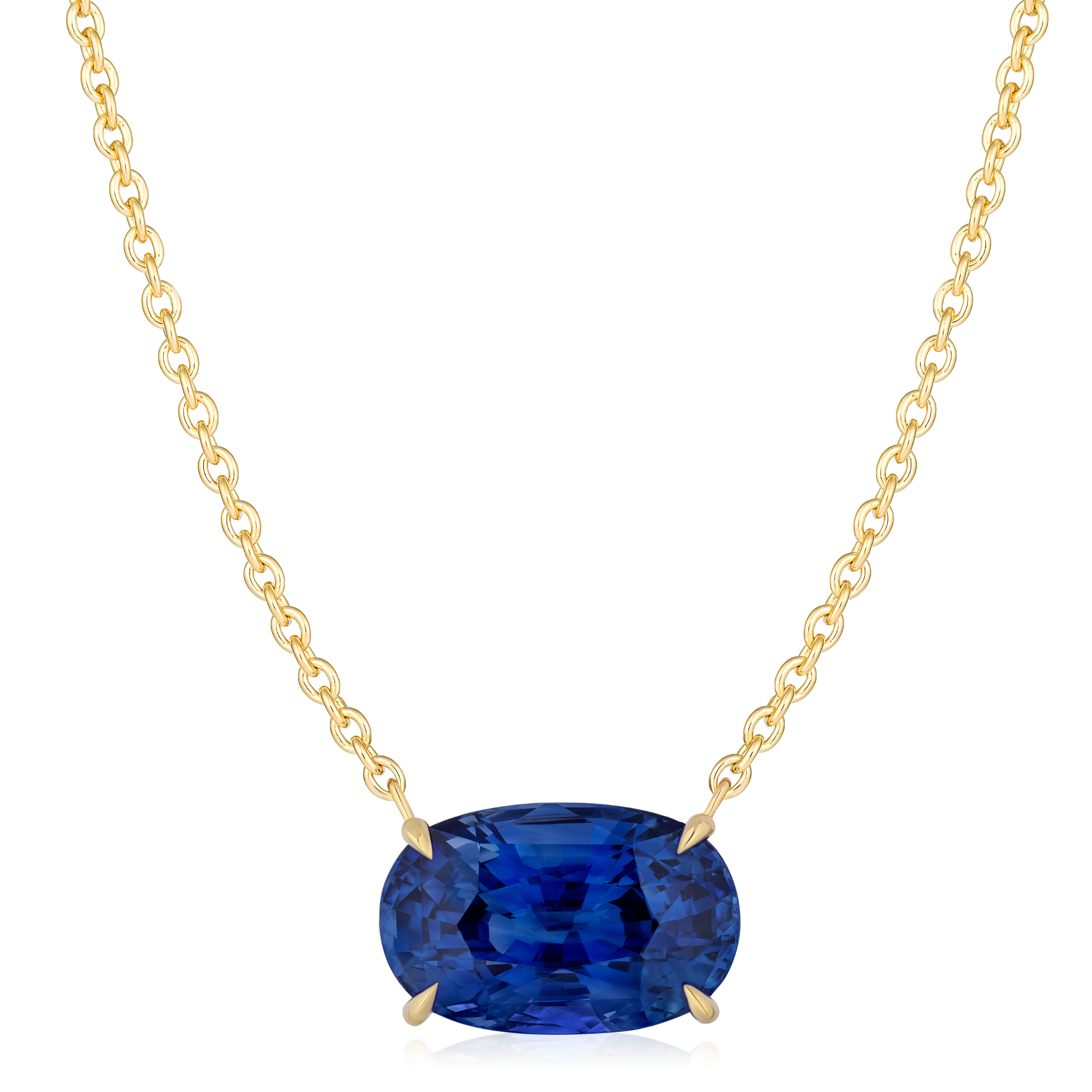 The East-West Oval Sapphire Pendant in Yellow Gold features a large oval sapphire set in a simple four-prong 18K yellow gold setting, displayed against a white background.