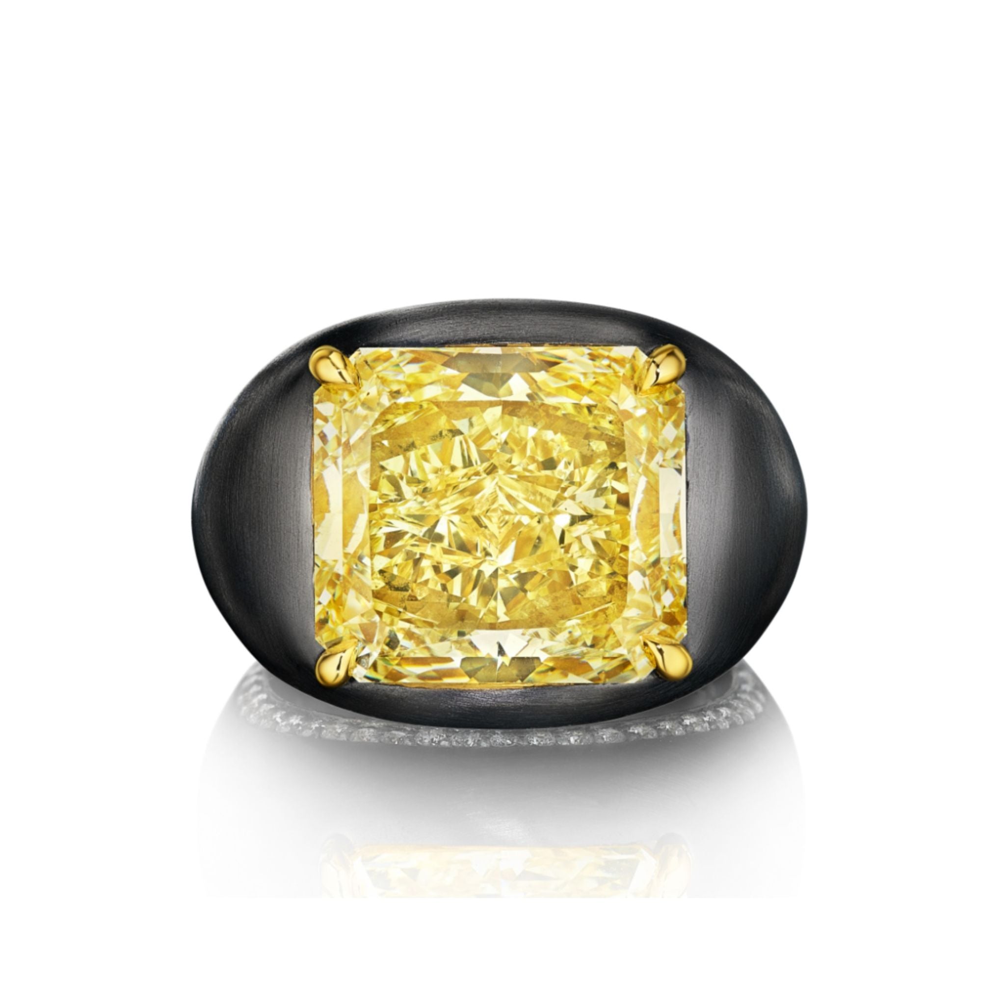 The East-West Prong Set Radiant Cut Yellow Diamond Signet Ring in Black Rhodium features a boldly set square yellow diamond with gold prongs, showcased against a white background with a subtle reflection.