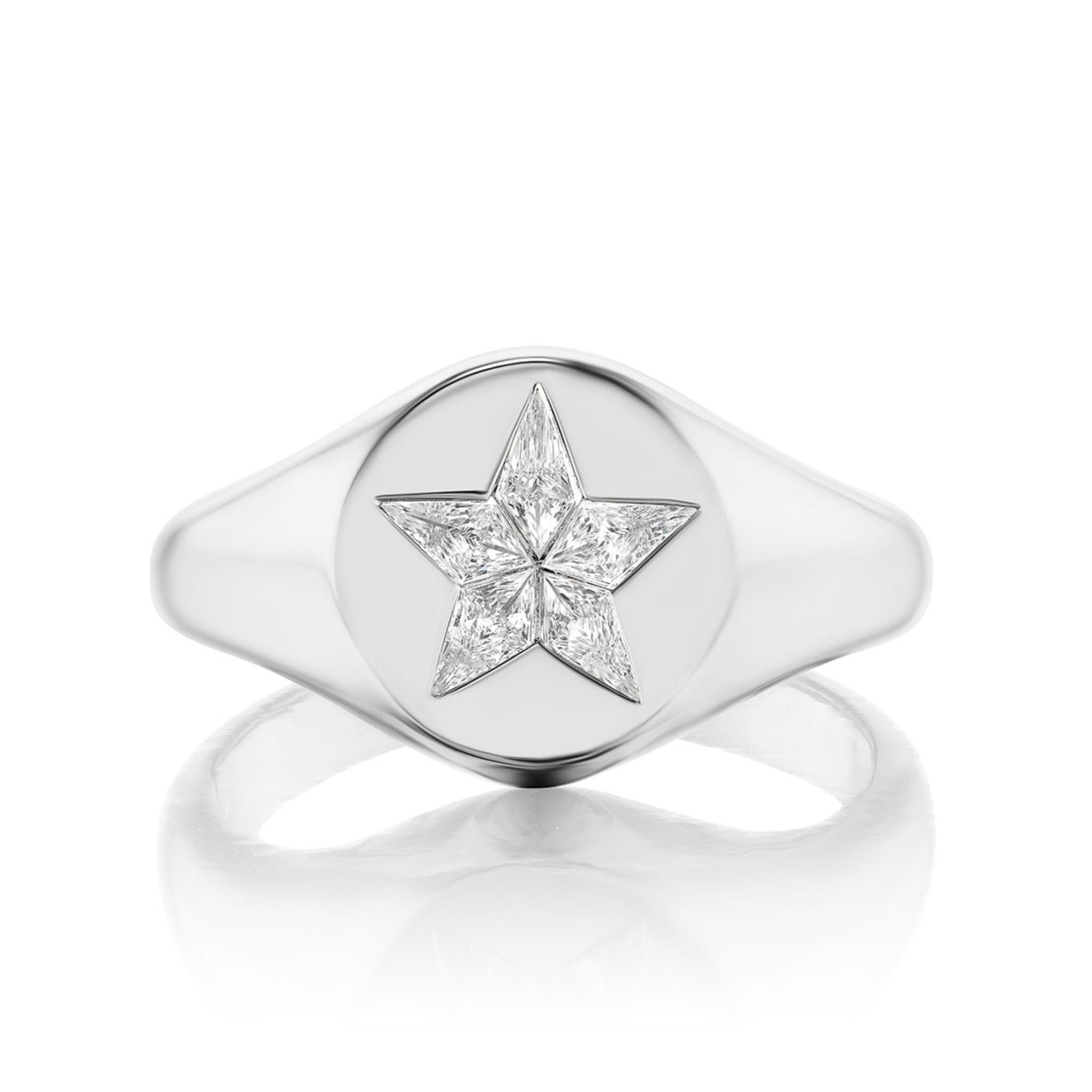 The Celestial Star Signet Ring with Kite Diamonds is crafted in 18K white gold, showcasing a polished face with a bold five-pointed star, each point embellished by sparkling kite-shaped diamonds.
