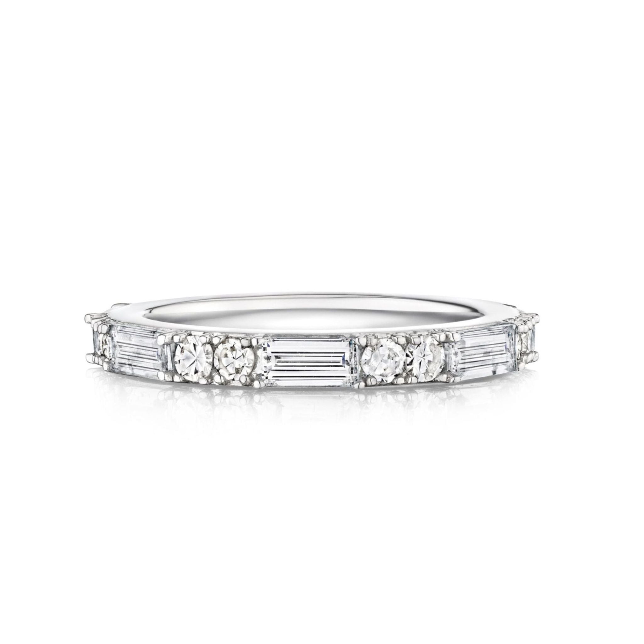 The East-West Set Baguette and Round Diamond Eternity Band in 18K white gold showcases alternating round and baguette diamonds encircling the band, displayed on a white background.