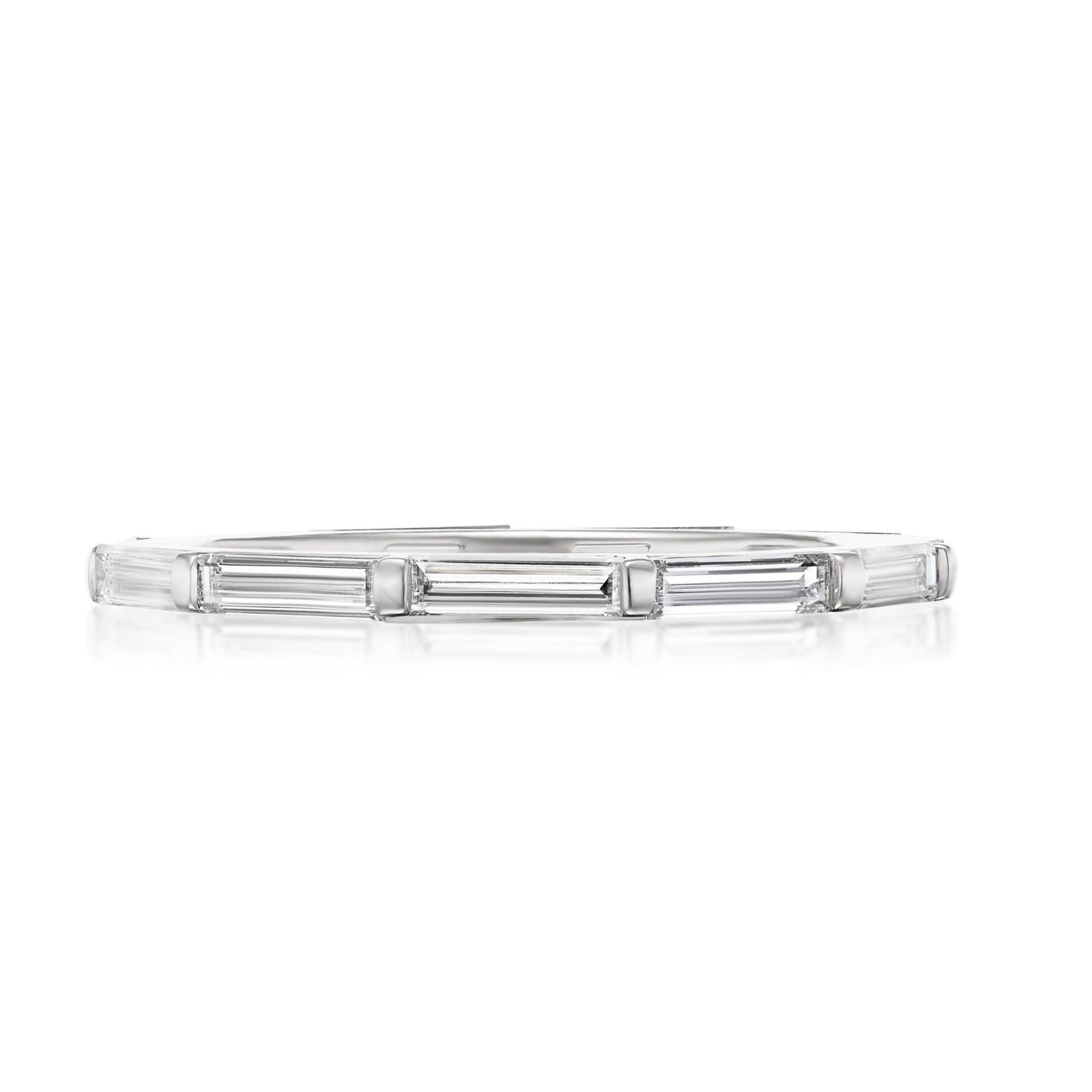 The East-West Thin Baguette Cut Diamond Eternity Band is a sleek, thin 18K white gold bracelet with evenly set rectangular baguette diamonds, shown on a white background.