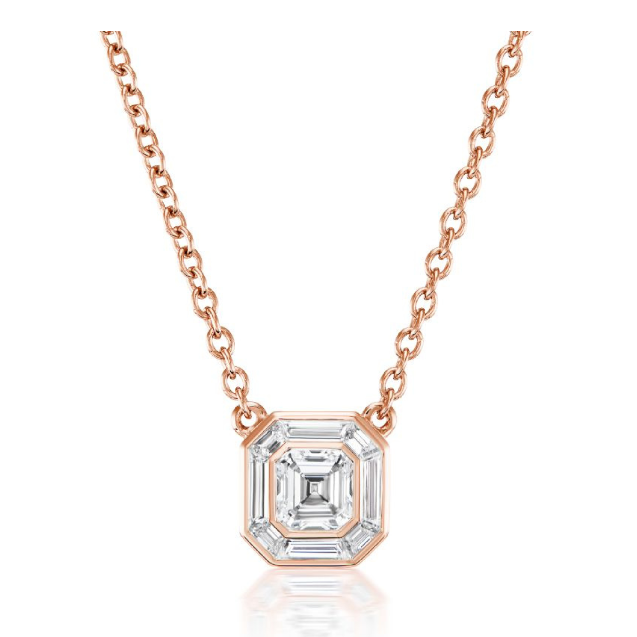 The Emerald Cut Diamond Mosaic Pendant in Rose Gold features an octagonal emerald-cut diamond in a bezel setting, inspired by Art Deco jewelry, and is displayed on a white background.