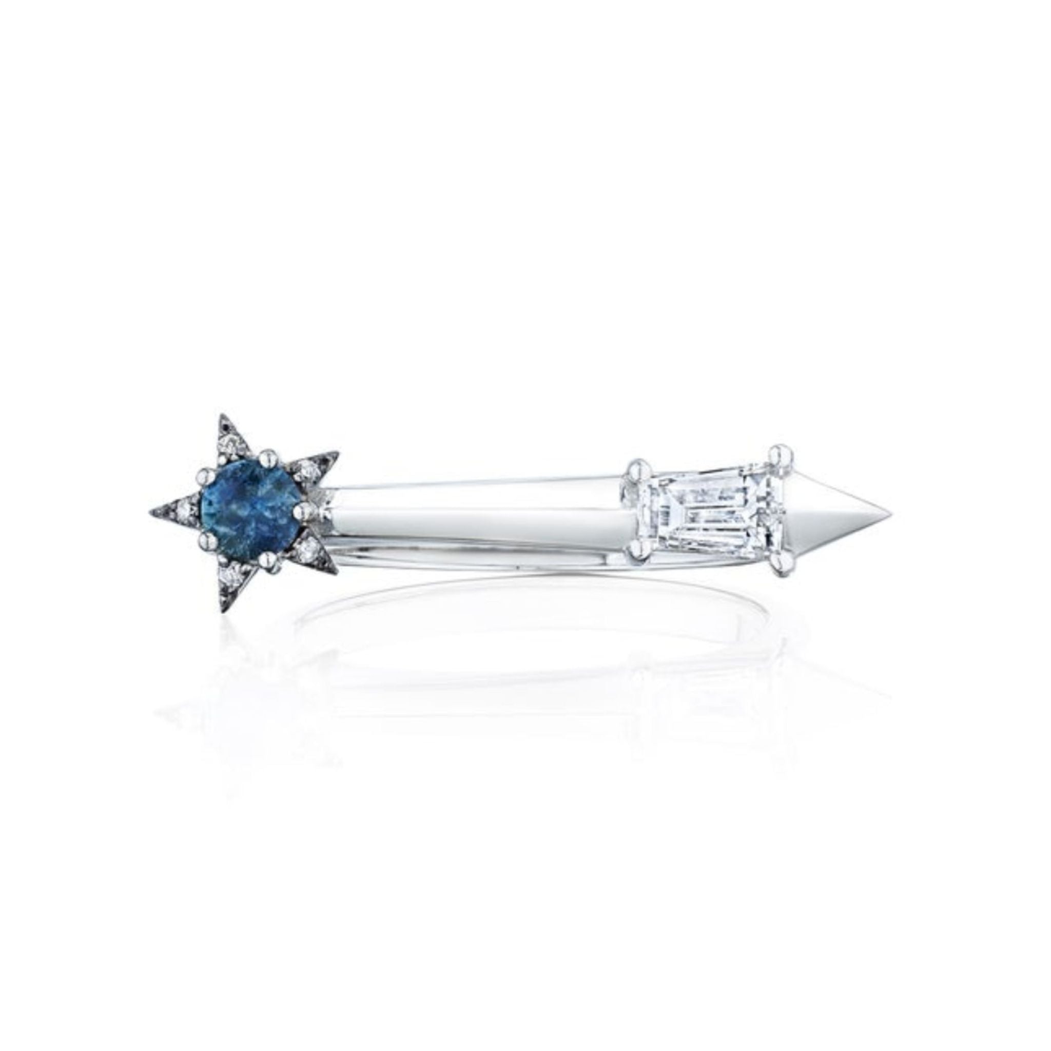 Introducing the America250 Star and Baguette Sapphire and Diamond Ring in Platinum—a platinum ring handcrafted in New York City, featuring a striking blue star-shaped sapphire on one end and a clear baguette diamond on the other, joined by a sleek, pointed band. Part of the exclusive America250 capsule collection, this elegant piece embodies modern sophistication.