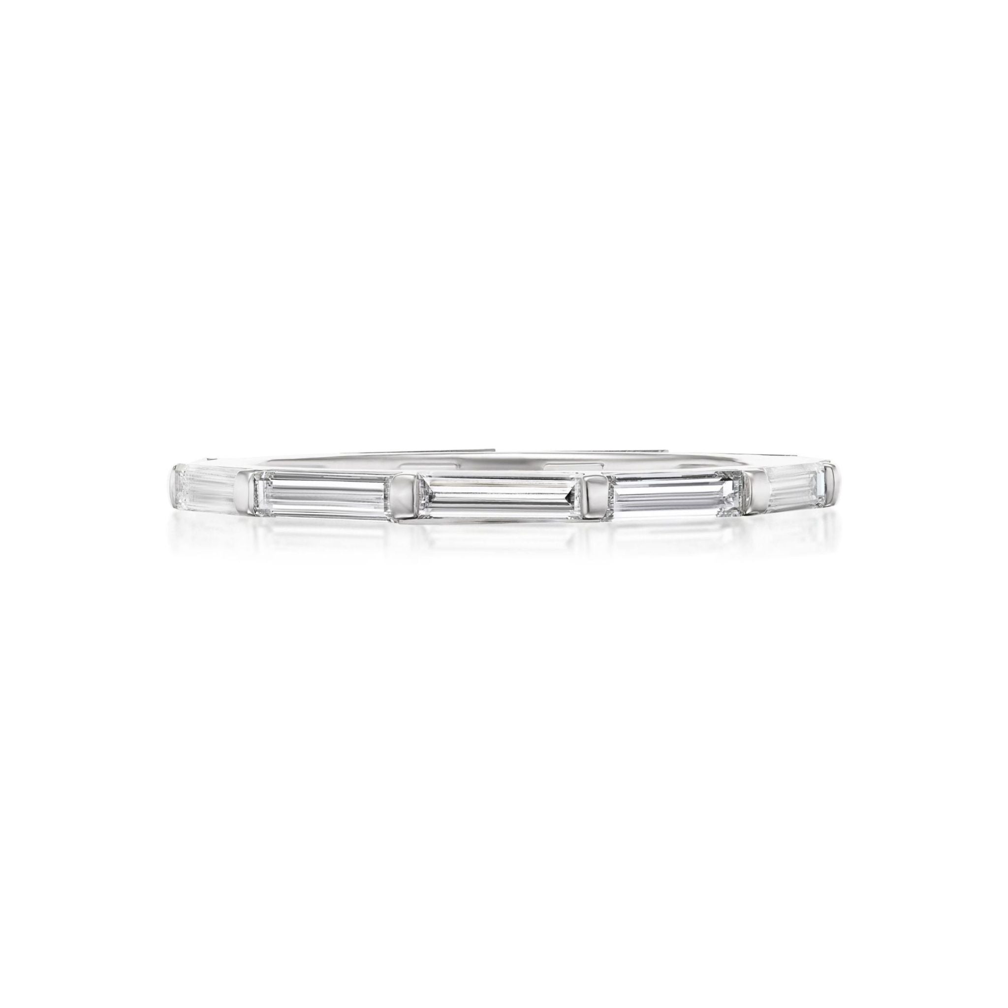 Introducing the East-West Thin Baguette Cut Diamond Eternity Band: a delicate silver bracelet featuring rectangular baguette-cut diamonds arranged in a continuous, minimalist design that evokes the timeless beauty of classic baguette settings, photographed on a white background.