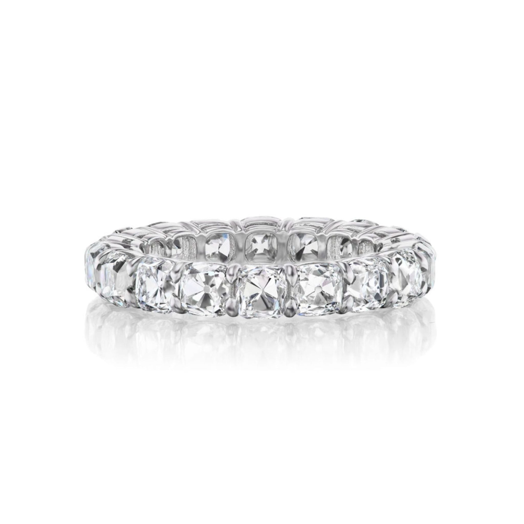 The Old Mine Cut Diamond Eternity Band, ideal as a celebration ring or for stacking with bridal bands, features a continuous row of square-cut clear diamonds and is displayed on a white background with a subtle reflection below.