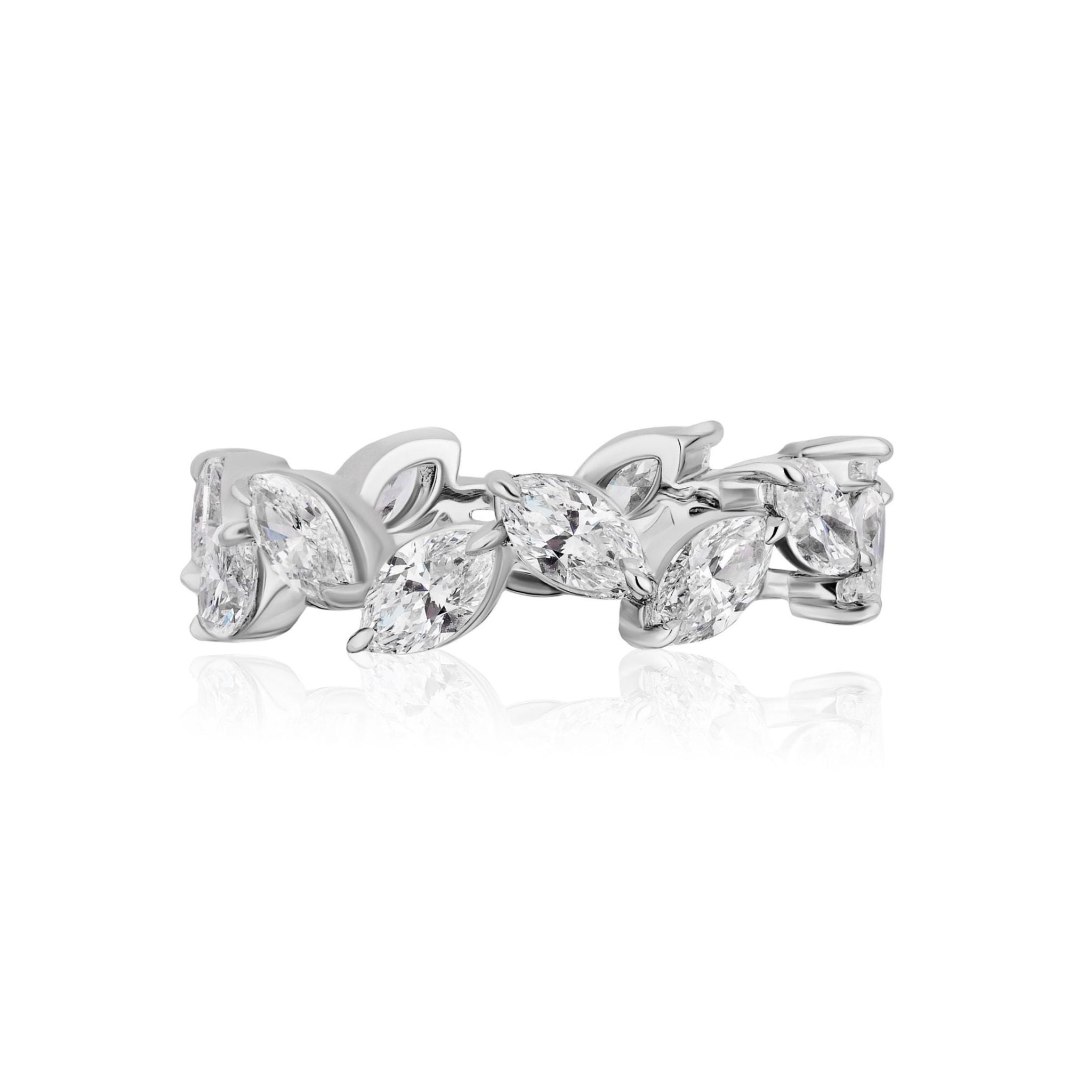 The Alternating Marquise Diamond Eternity Band is a silver ring adorned with marquise-cut clear gemstones set in a leaf-like pattern, evoking the elegance and natural beauty of Marquise Diamonds.