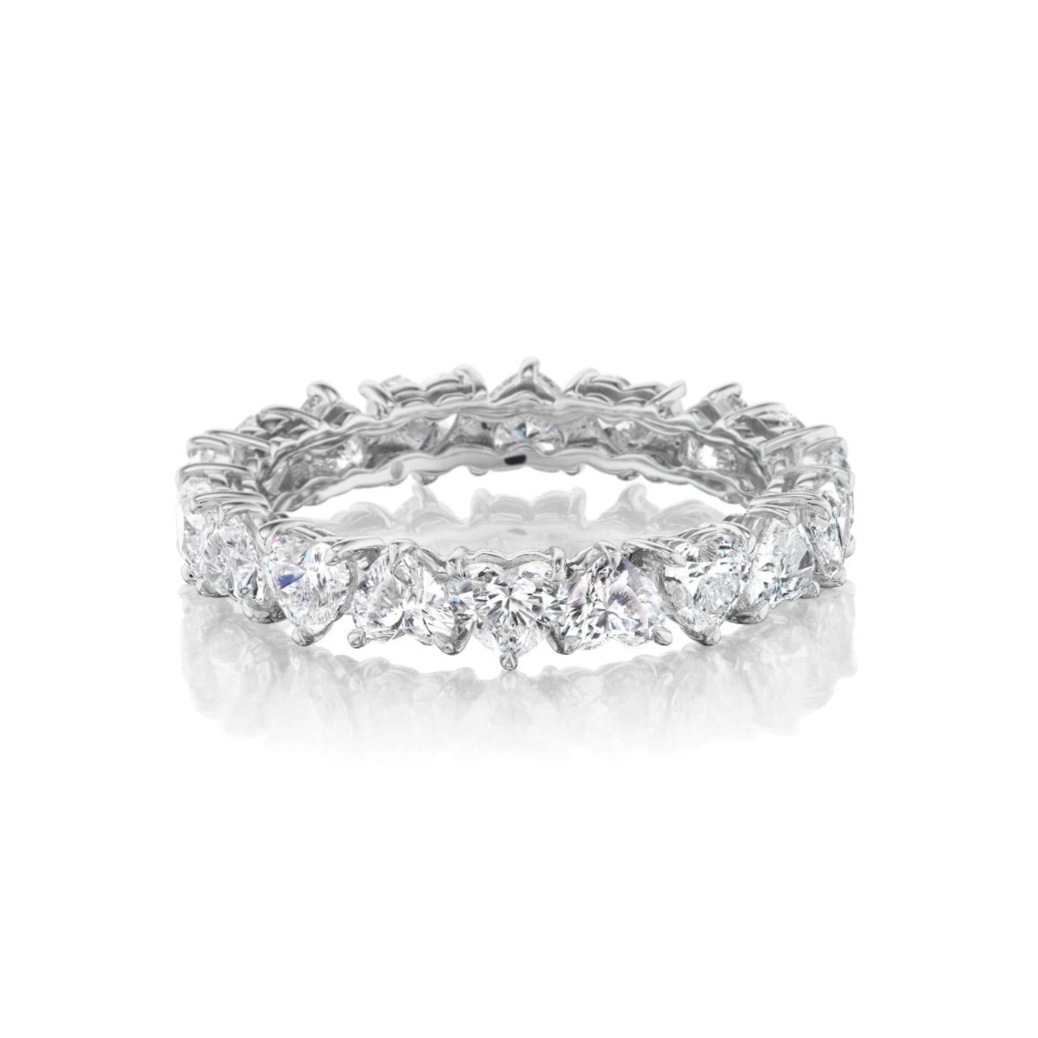 Introducing the Up and Down Heart Diamond Eternity Band: a platinum eternity ring showcasing a seamless circle of closely set, heart-shaped diamonds. This beautiful design is the ideal choice for those searching for unique bridal or celebration rings. Displayed on a white background.