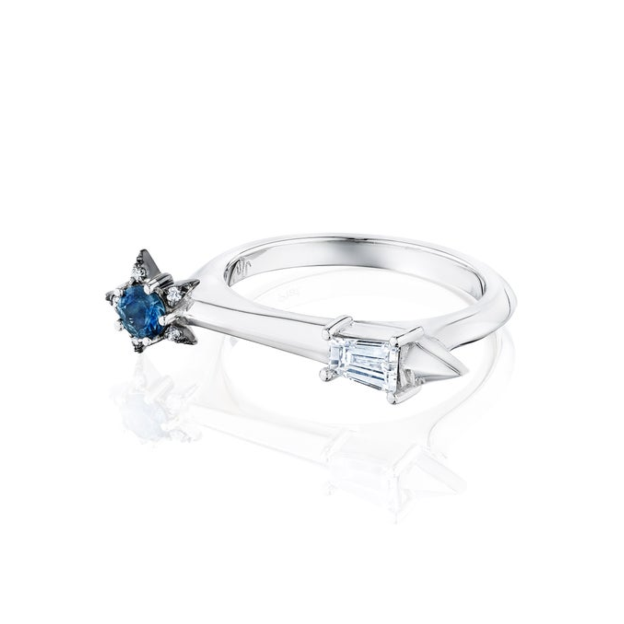 America250 Star and Baguette Sapphire and Diamond Ring in Platinum, handcrafted in New York City, features a star-shaped blue sapphire on one end and a horizontally set rectangular white diamond on the other, displayed against a white background.
