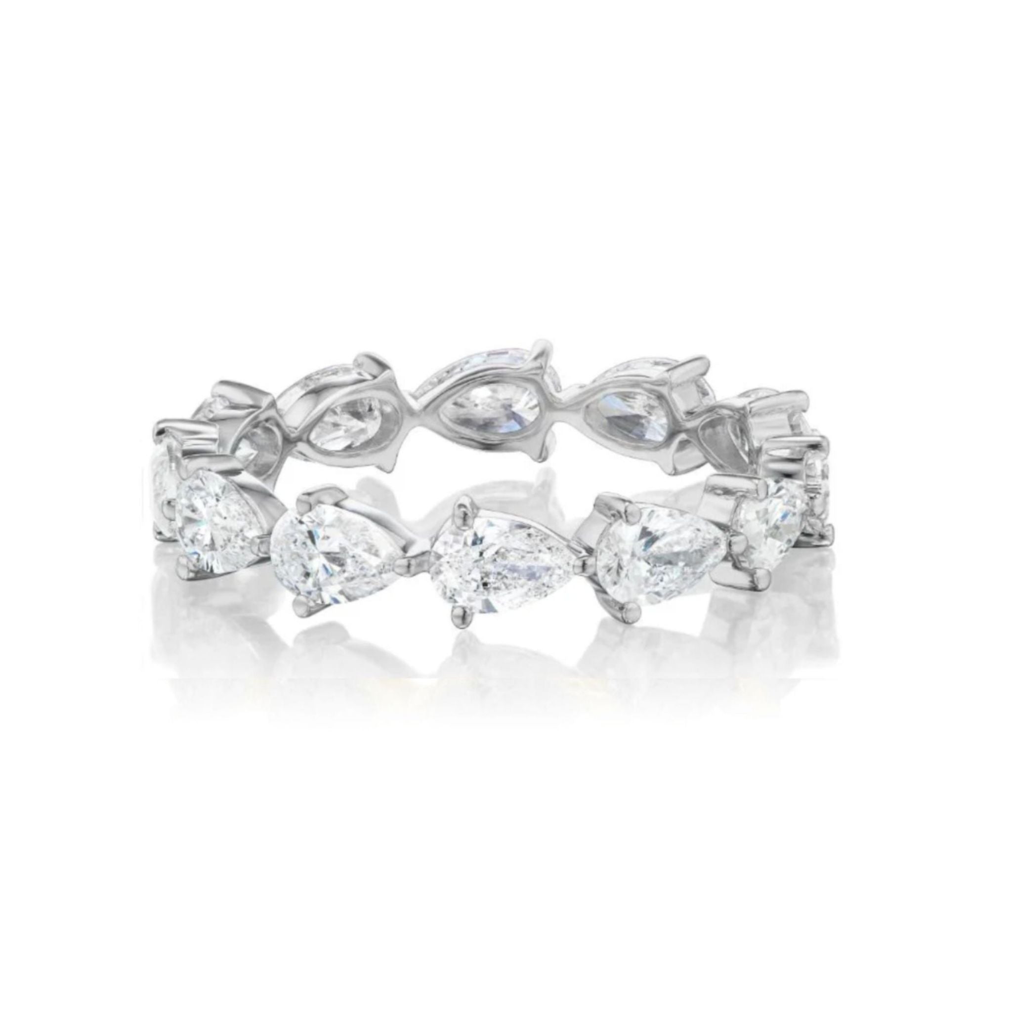 The Chasing Pears Eternity Band is a silver ring featuring alternating pear-shaped diamonds and marquise-shaped clear gemstones arranged in a continuous pattern around the band. Available in size 6.