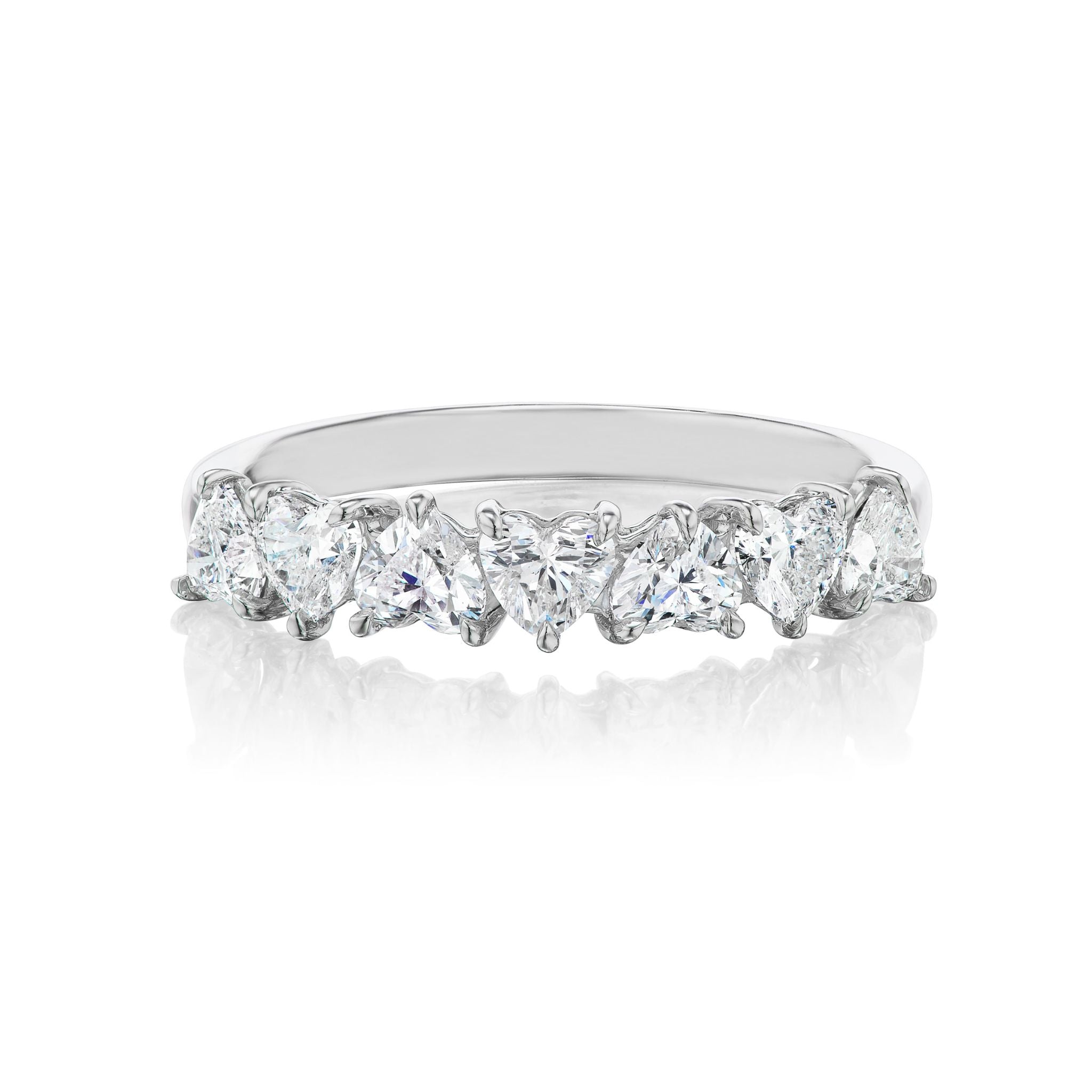 The Up and Down Heart Diamond Half Eternity Band, crafted in white gold and adorned with seven pear-shaped diamonds arranged in a row, is perfect for bridal or celebration rings. Photographed on a white background.