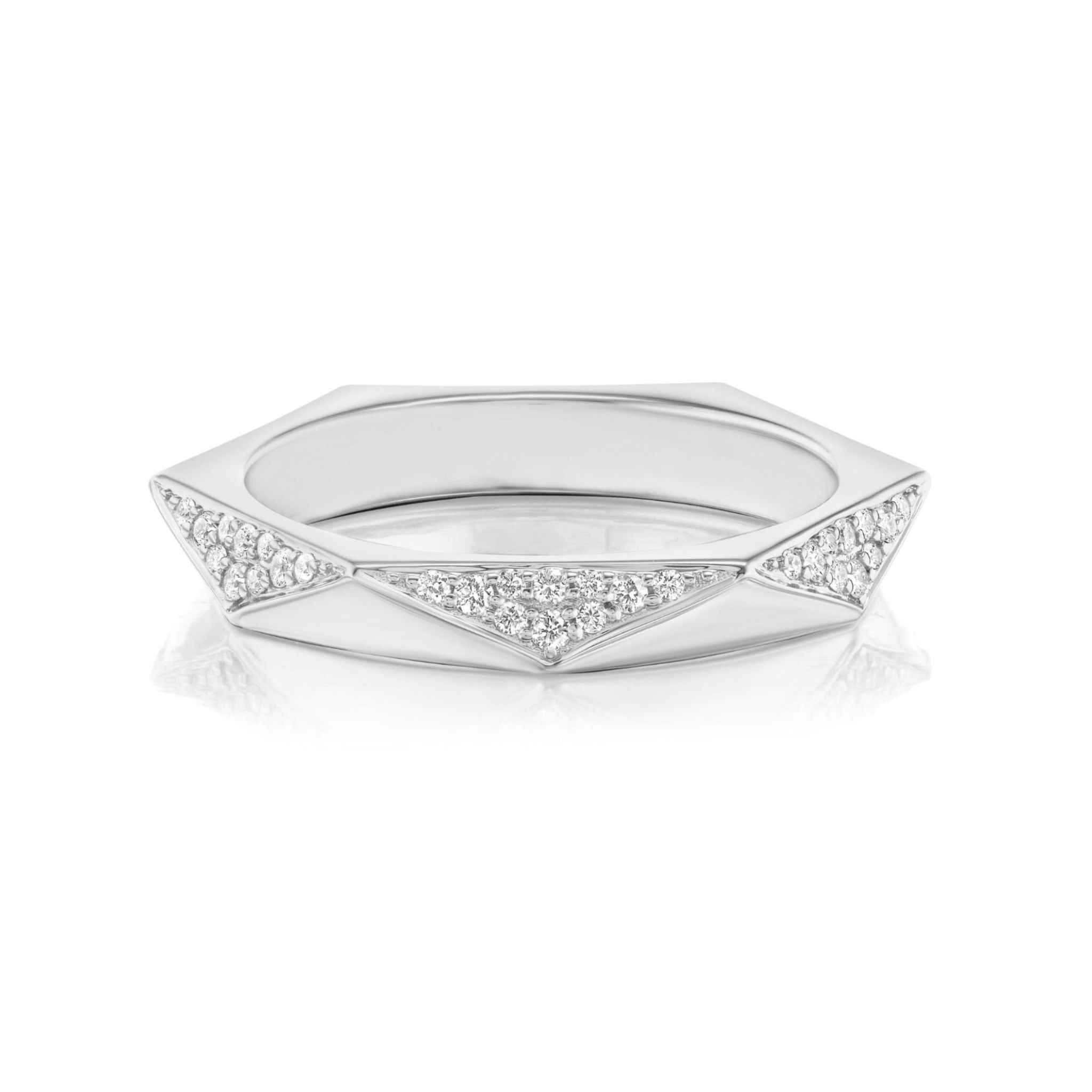 The Triangular Geometric Pavé Band is a silver ring with angular facets and several triangular sections adorned with small, round SI-clarity diamonds, showcased on a white reflective surface.