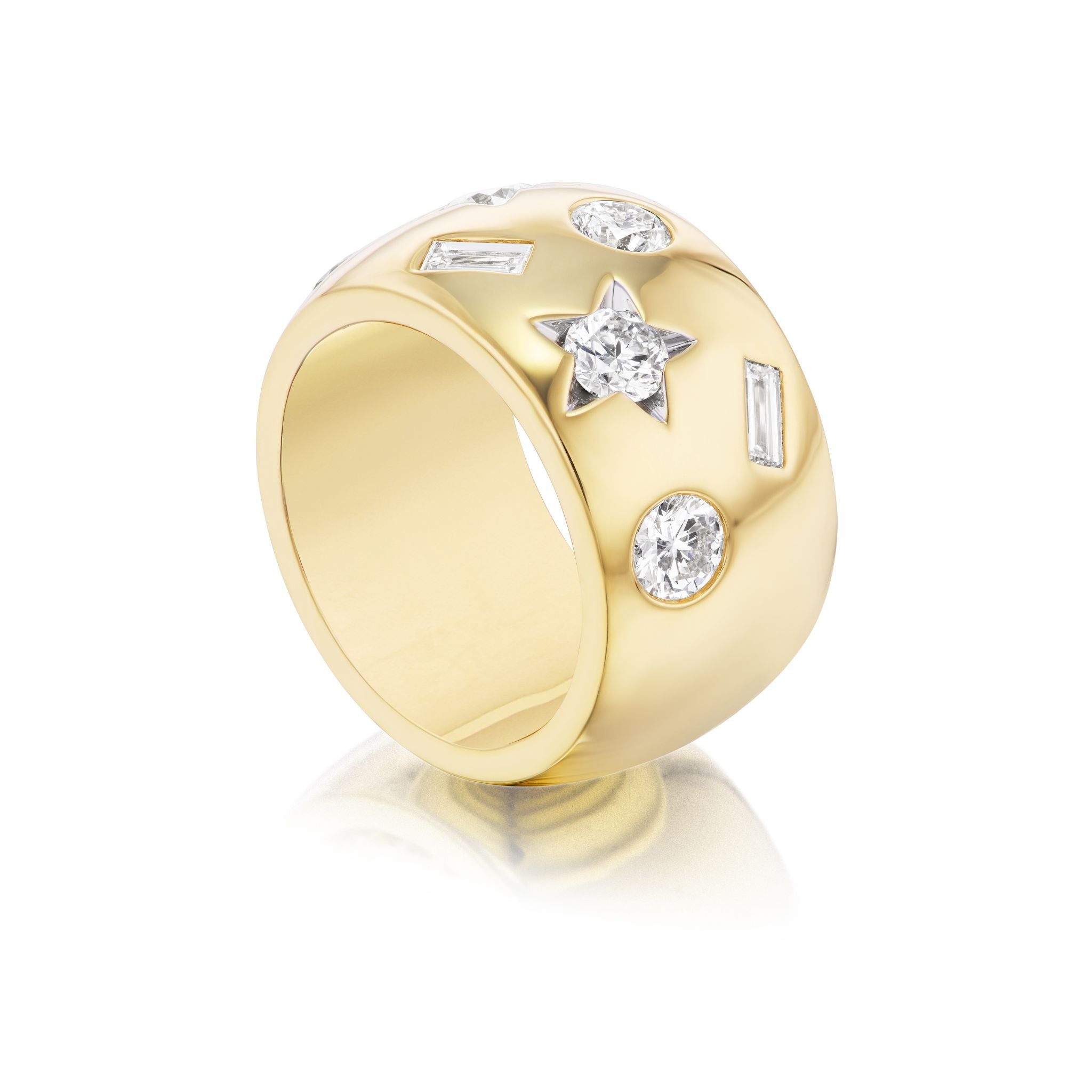 Featuring round, baguette, and star-shaped diamond accents set on its surface, the Large Celestial Cigar Band in Yellow Gold with Mixed Shape Diamonds embodies the allure of celestial jewelry. Photographed on a white background with a subtle reflection below.